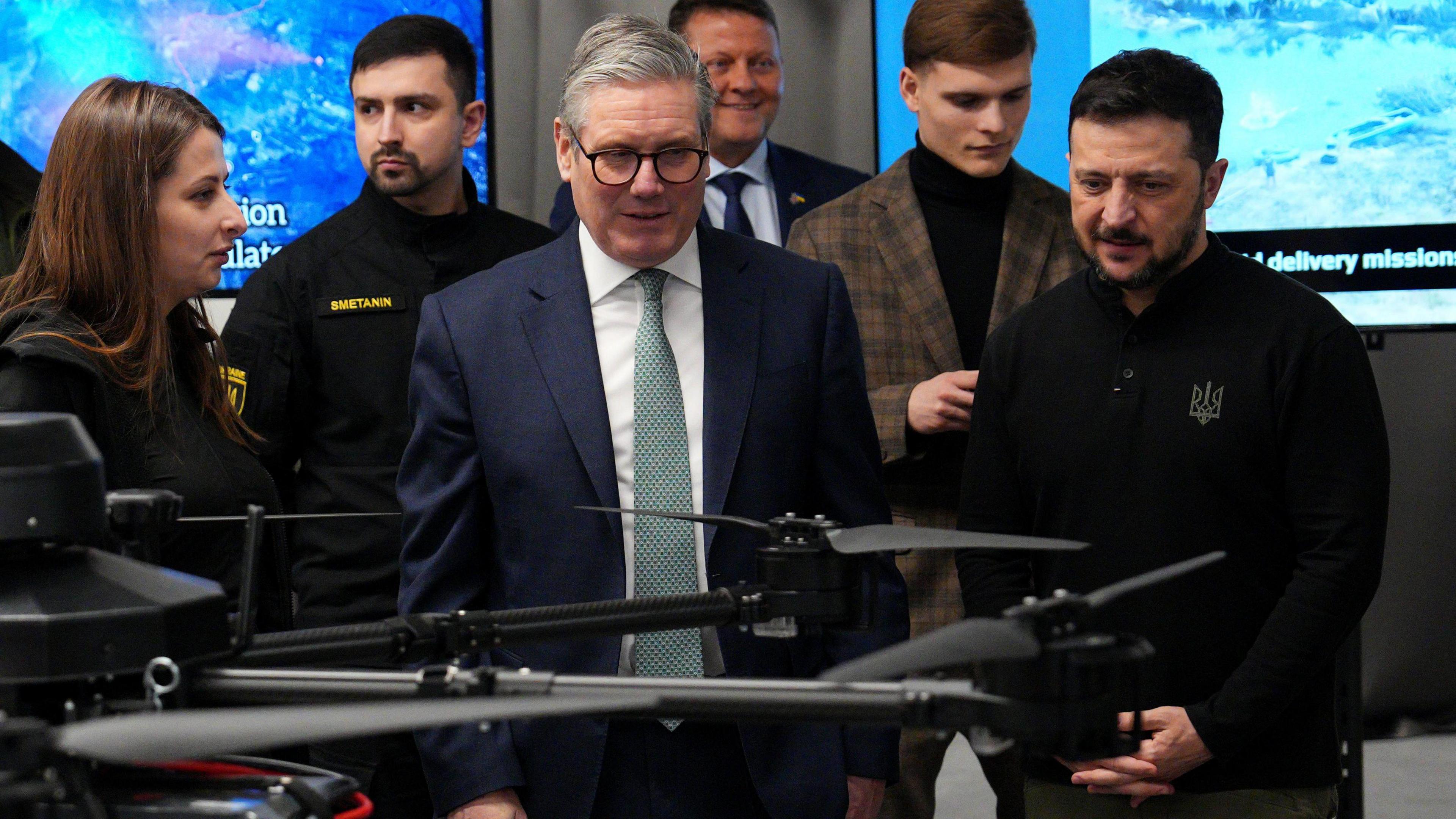 Prime Minister Sir Keir Starmer (centre) and Ukrainian President Volodymyr Zelensky ( right) attend a presentation of Ukrainian military drones at an undisclosed location, during his visit to Ukraine to sign a new long-term partnership deal with Volodymyr Zelensky