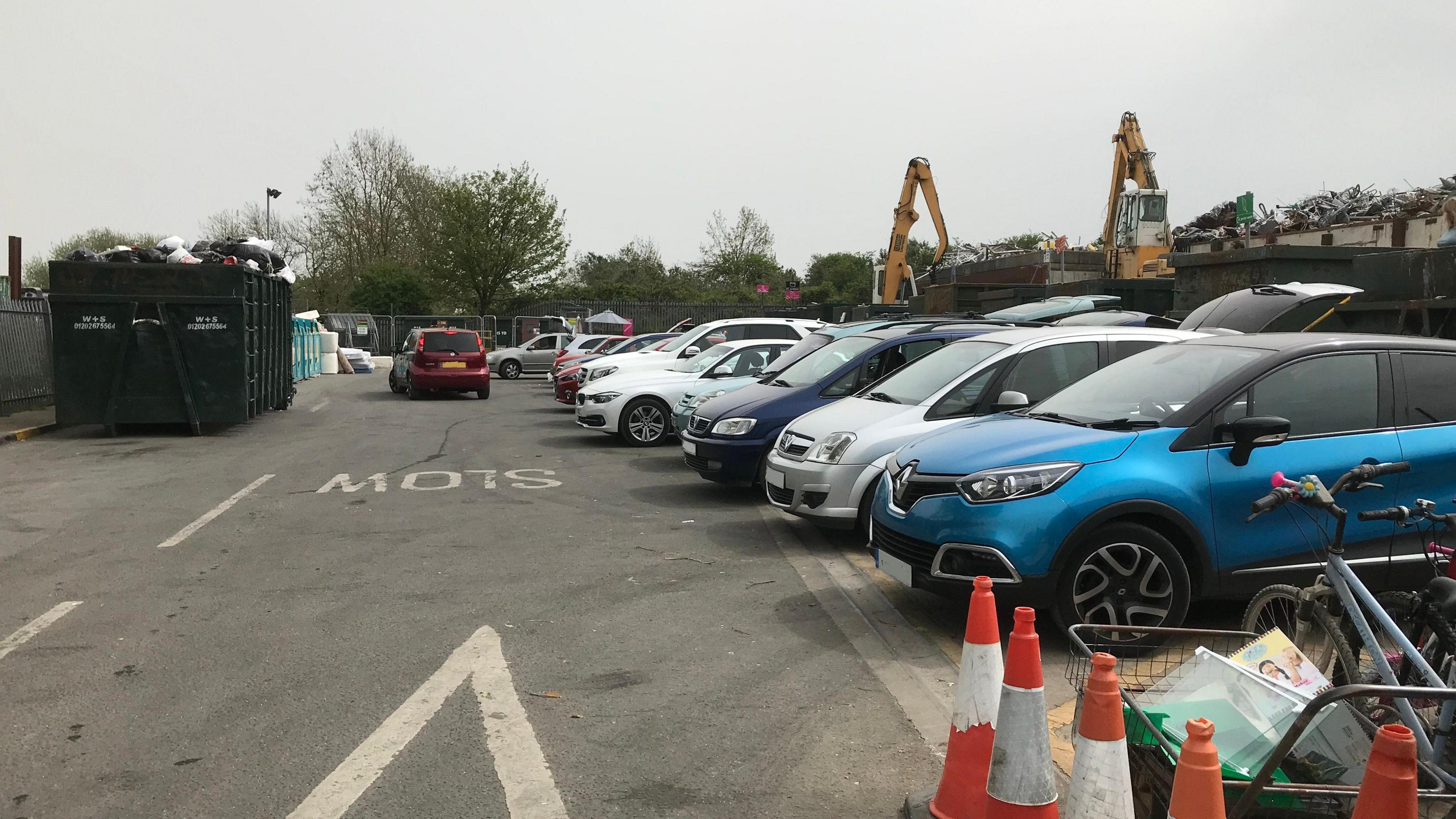 Cars parked at the waste recycling centre