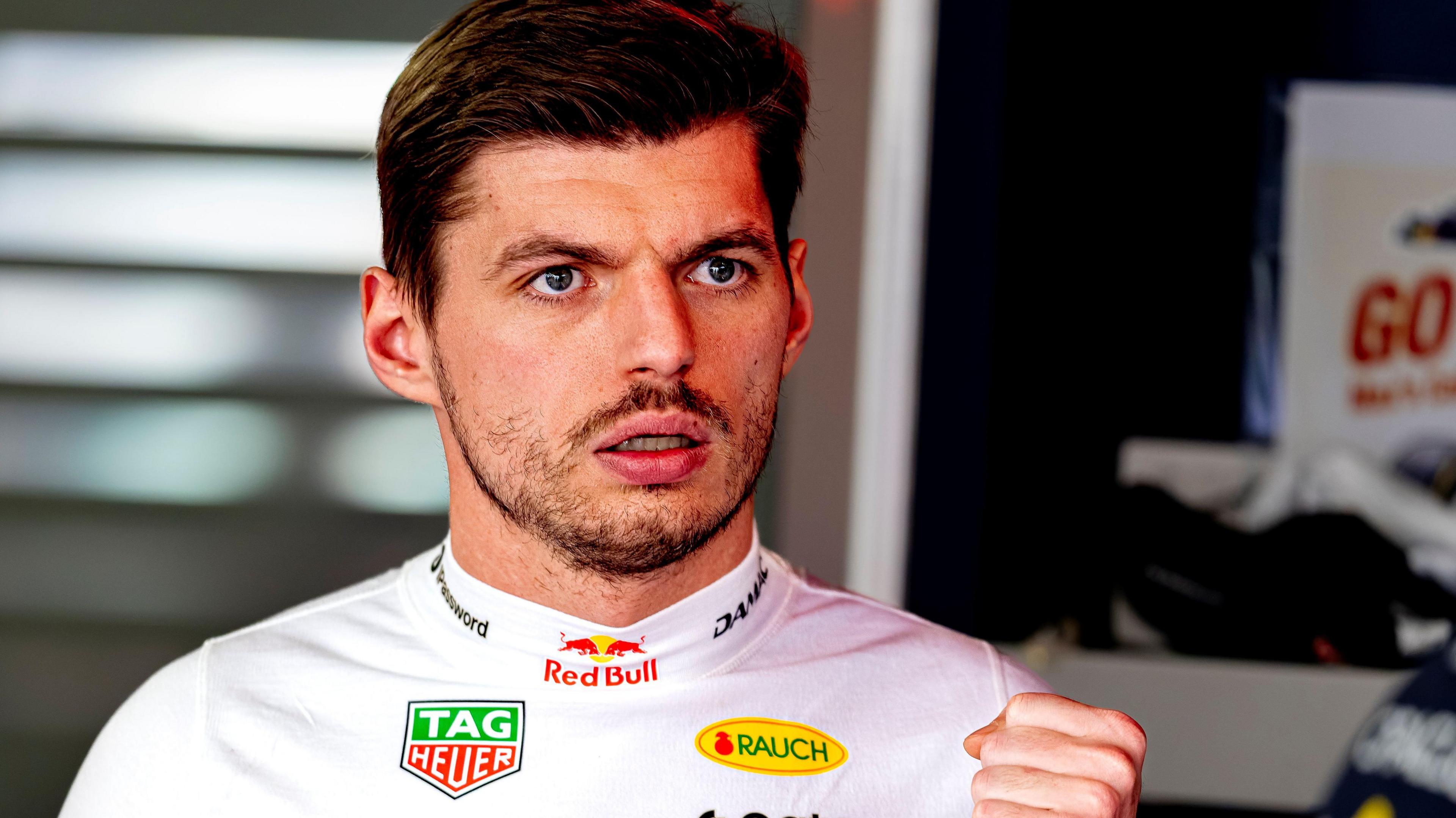 Max Verstappen wearing a white fireproof top in the Red Bull garage at the Japanese Grand Prix