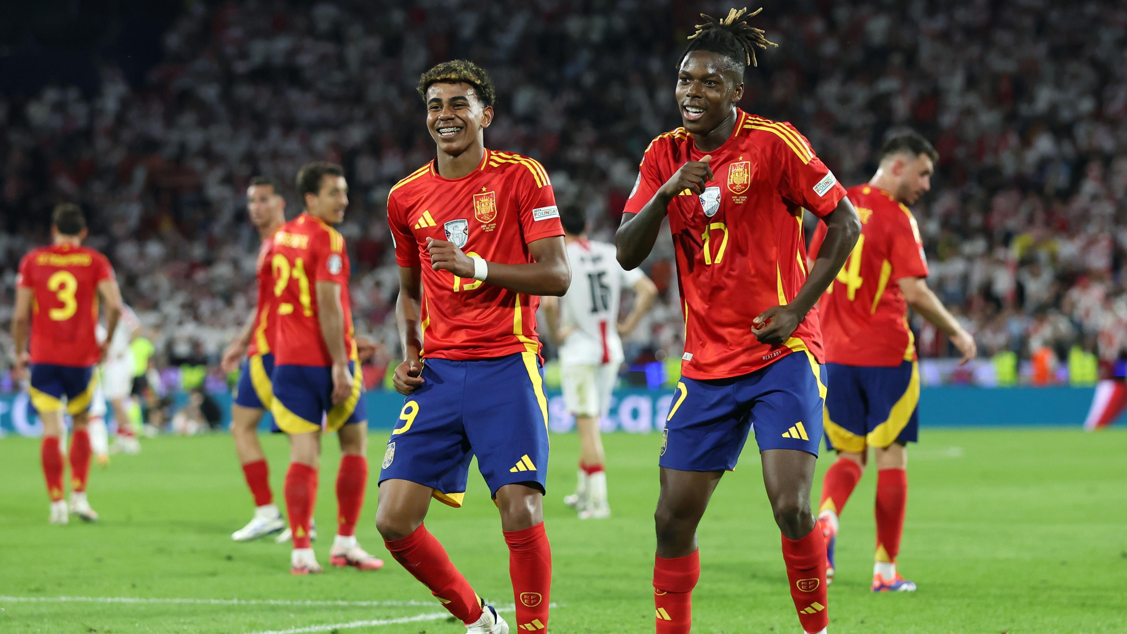 Lamine Yamal and Nico Williams celebrate Spain's win against Georgia at Euro 2024