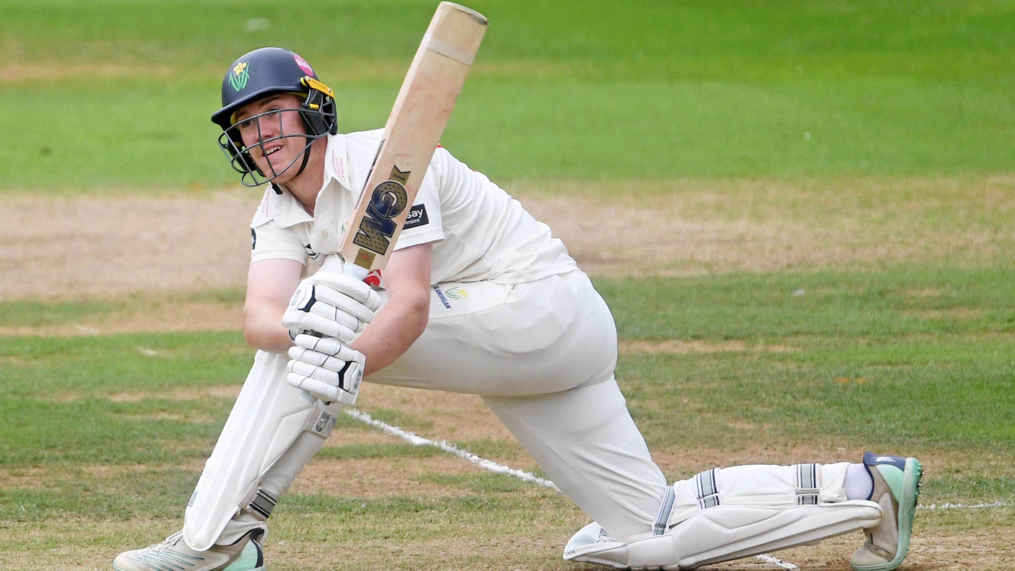 Ben Kellaway playing a sweep shot while batting