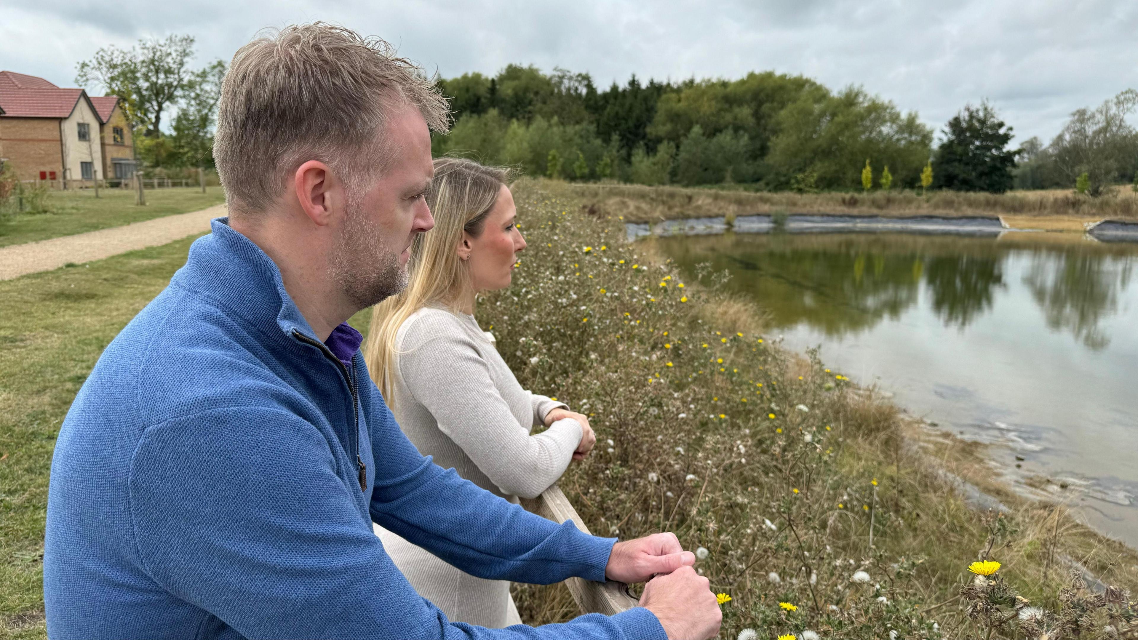 Residents look at new lagoon