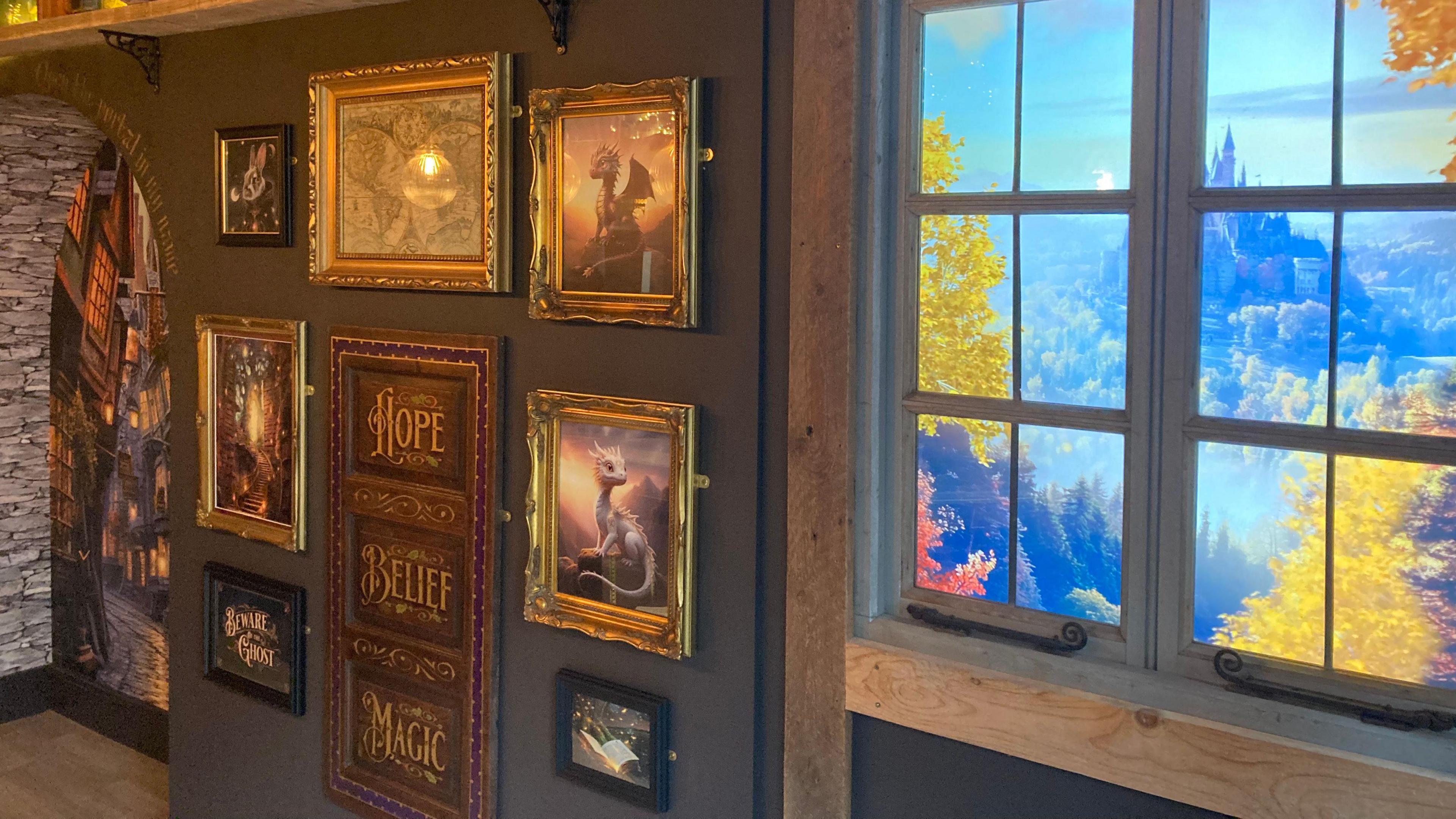 A shop with a wall covered in magic-themed paintings and images