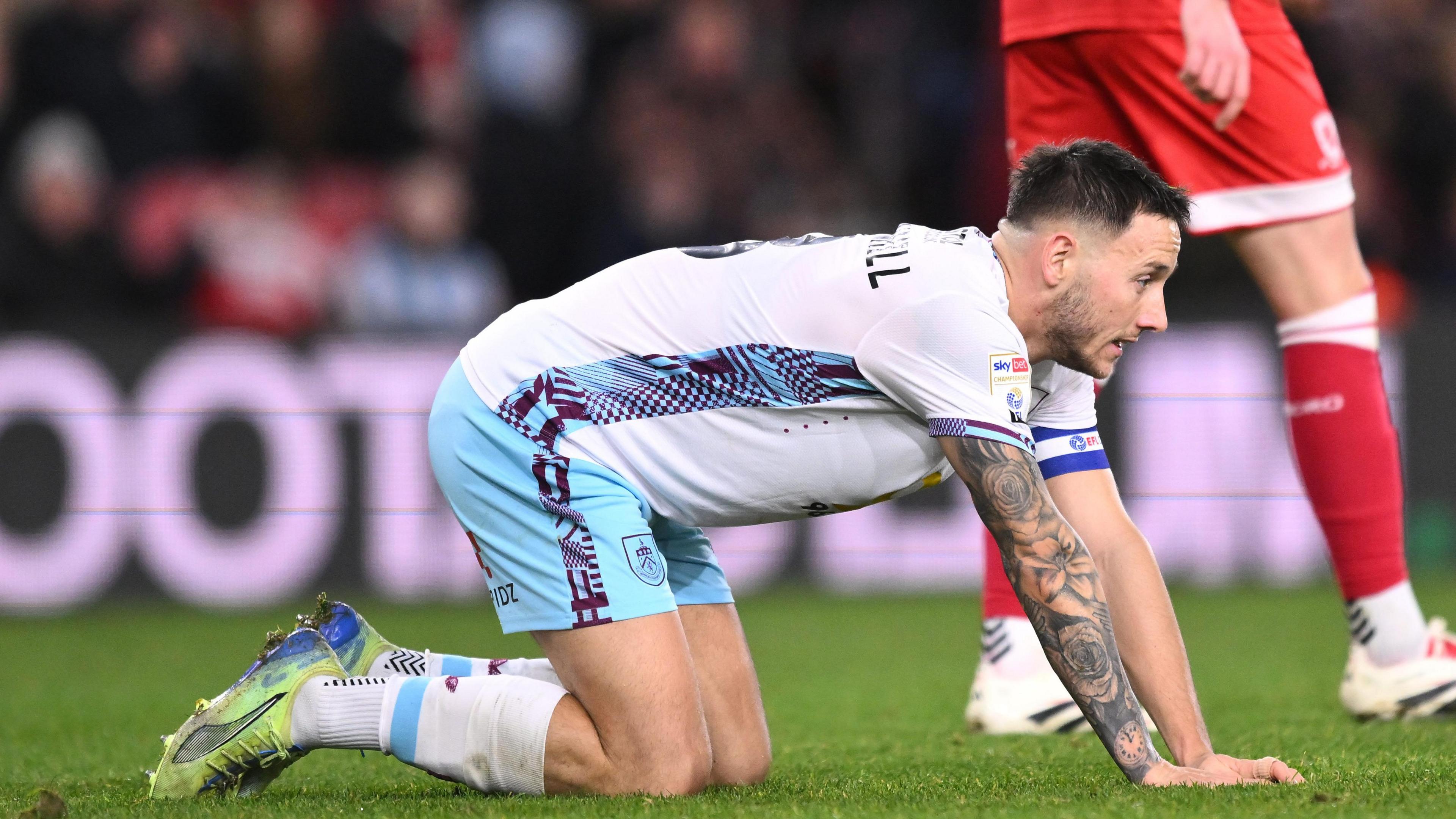 Josh Brownhill on his knees after missing a sitter for Burnley