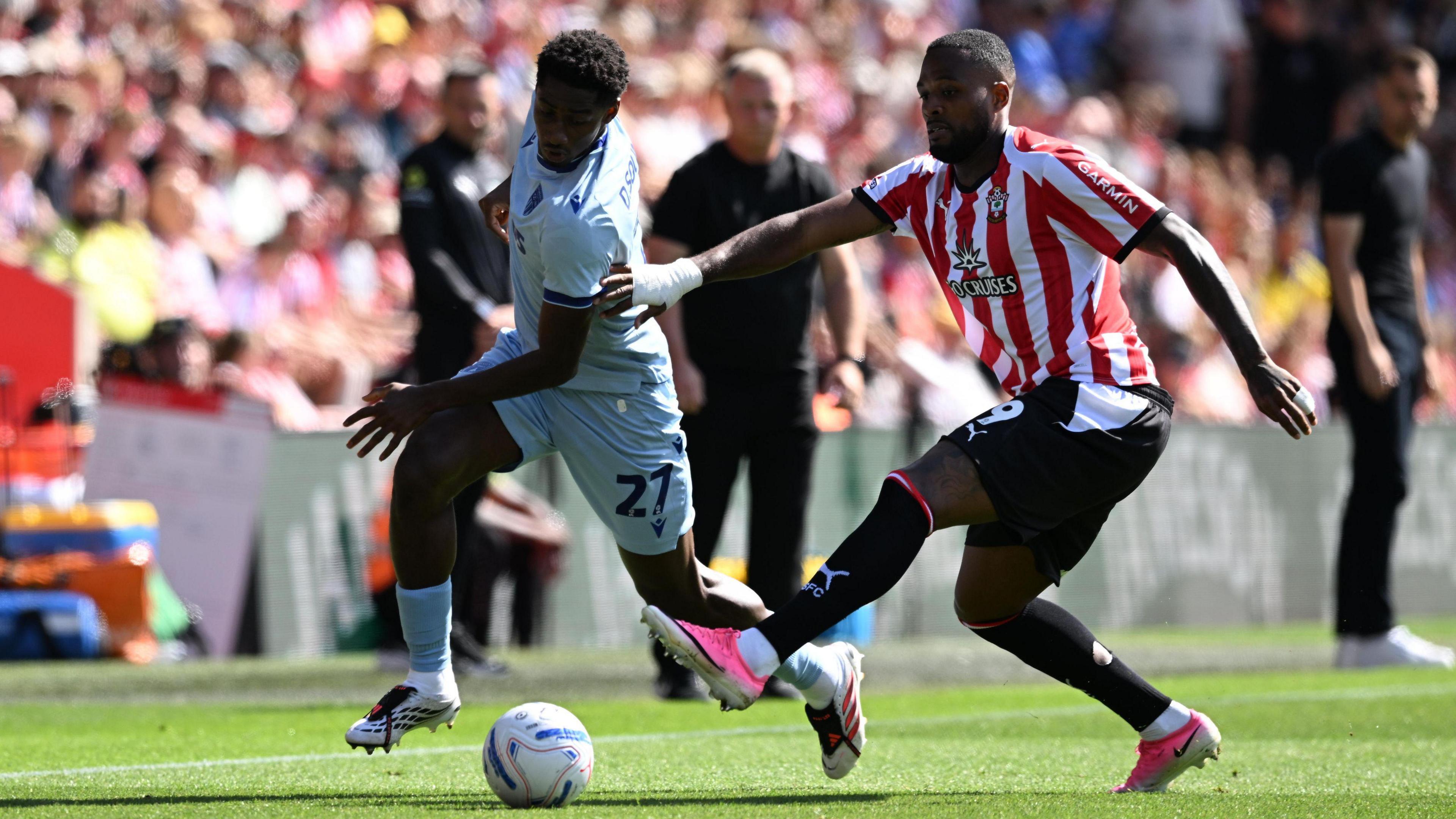Southampton's Cyle Larin and Stoke City's Djibril Soumare battle for the ball during their Championship match on Saturday