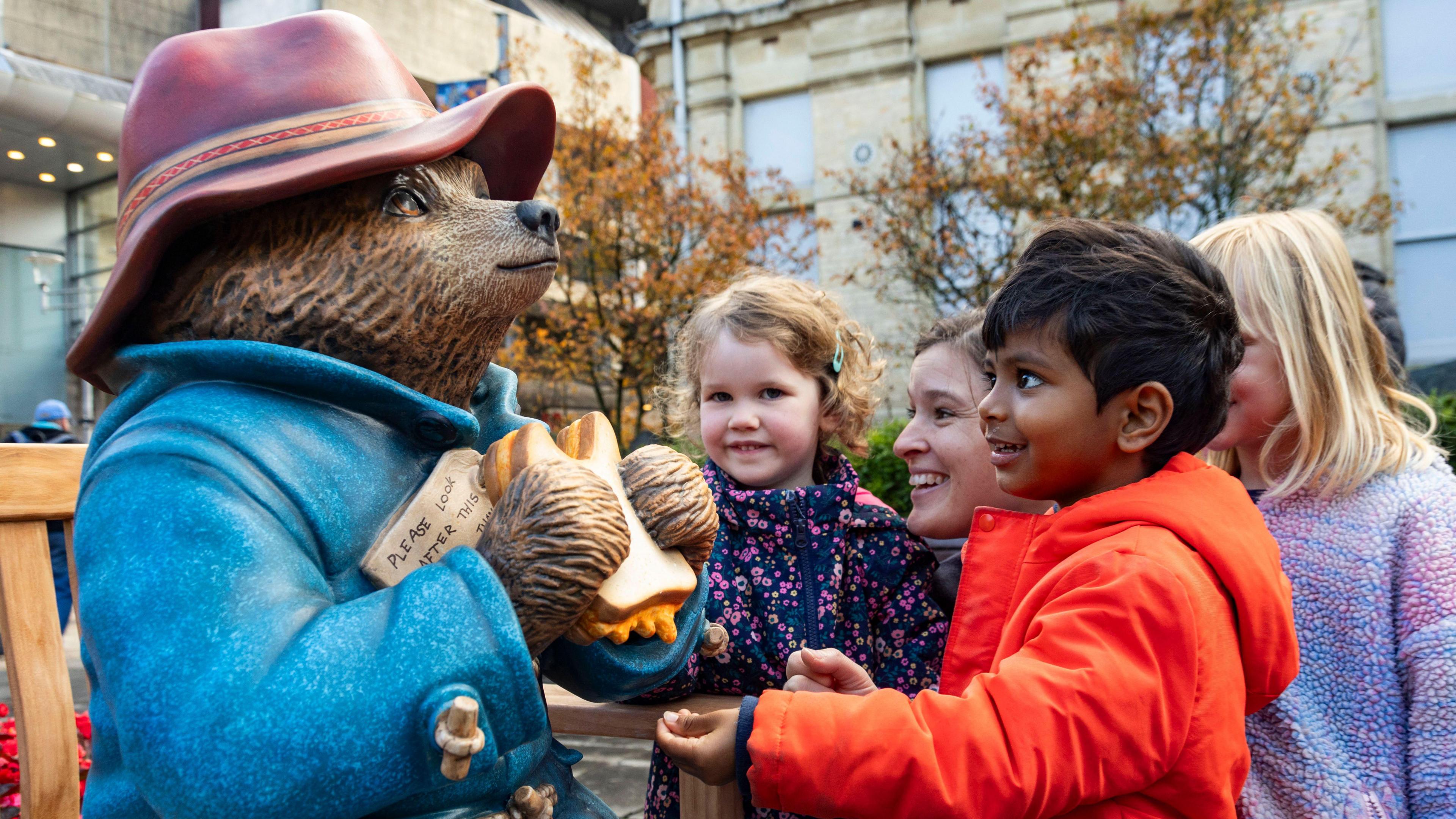 Paddington statue and kids in Cardiff.