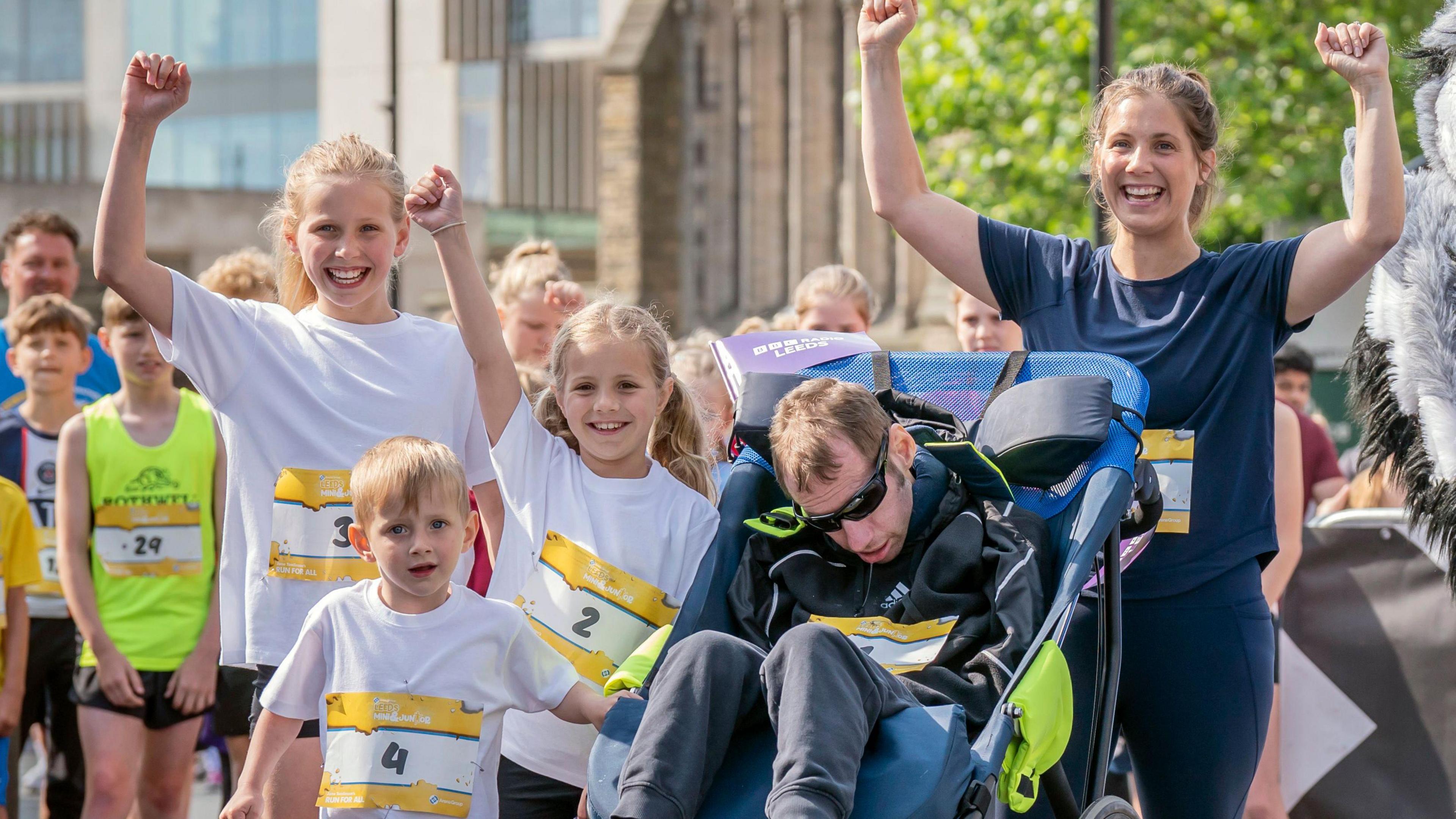 Rob Burrow with his children, left to right, Macy, Jackson, Maya and his wife Lindsey Burrow at the start of the Arena Group Leeds Mini and Junior Run 2023 in Leeds. 