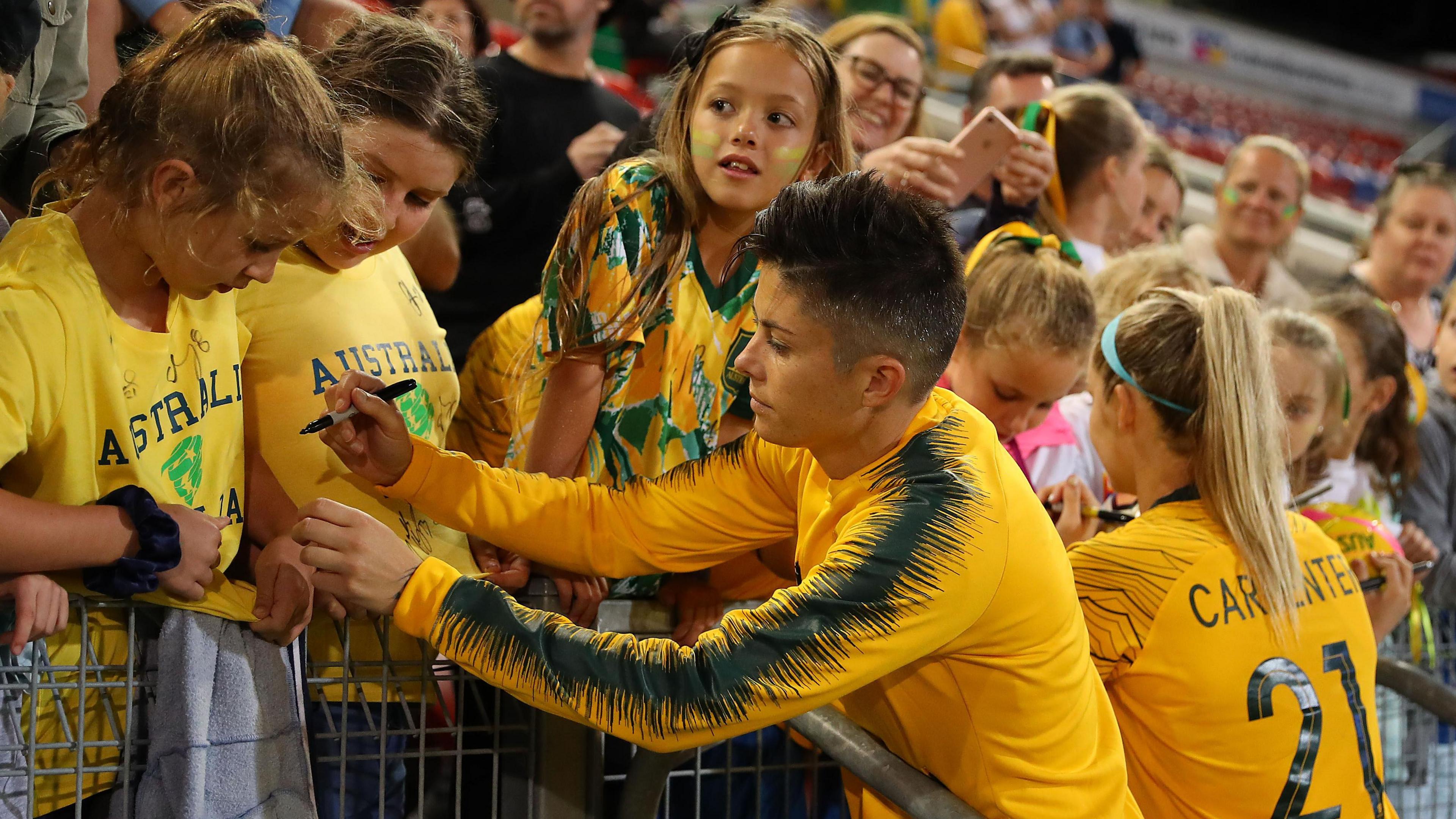 Michelle Heyman signs autographs