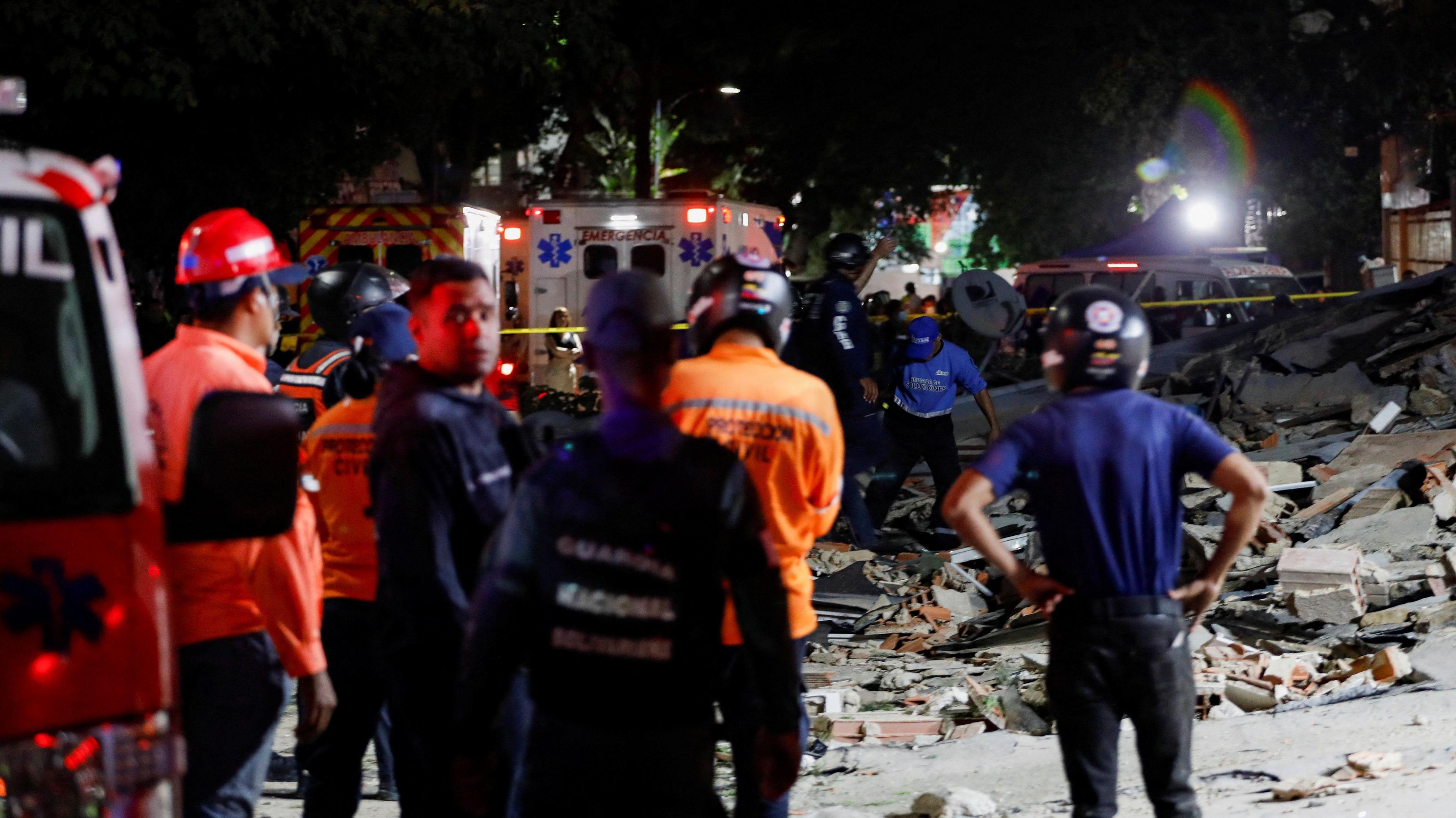 Rescuers work at the site of damaged buildings in the aftermath of an earthquake, in Caracas, Venezuela