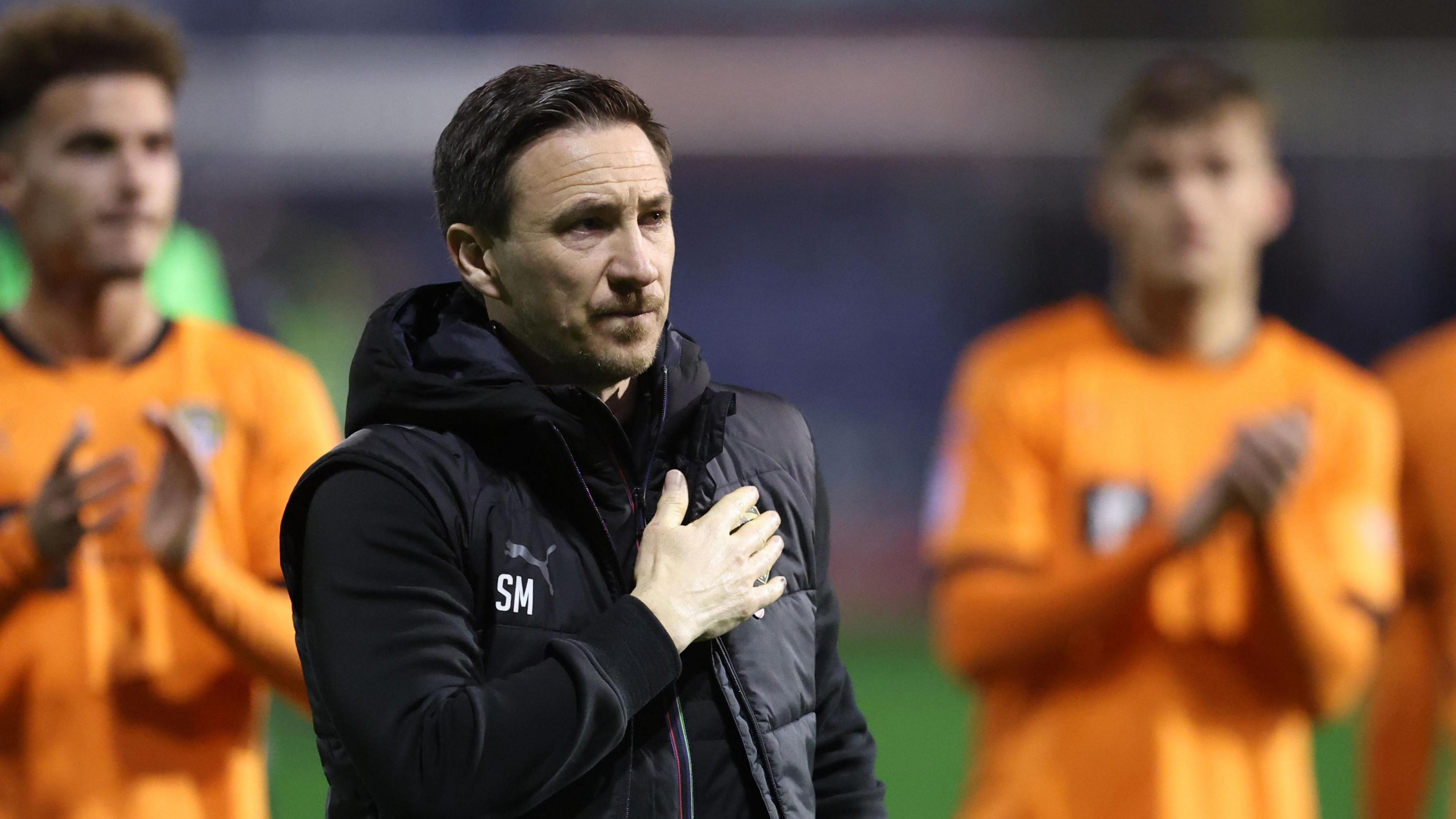 Stuart Maynard and his players acknowledges Notts County fans after a game.