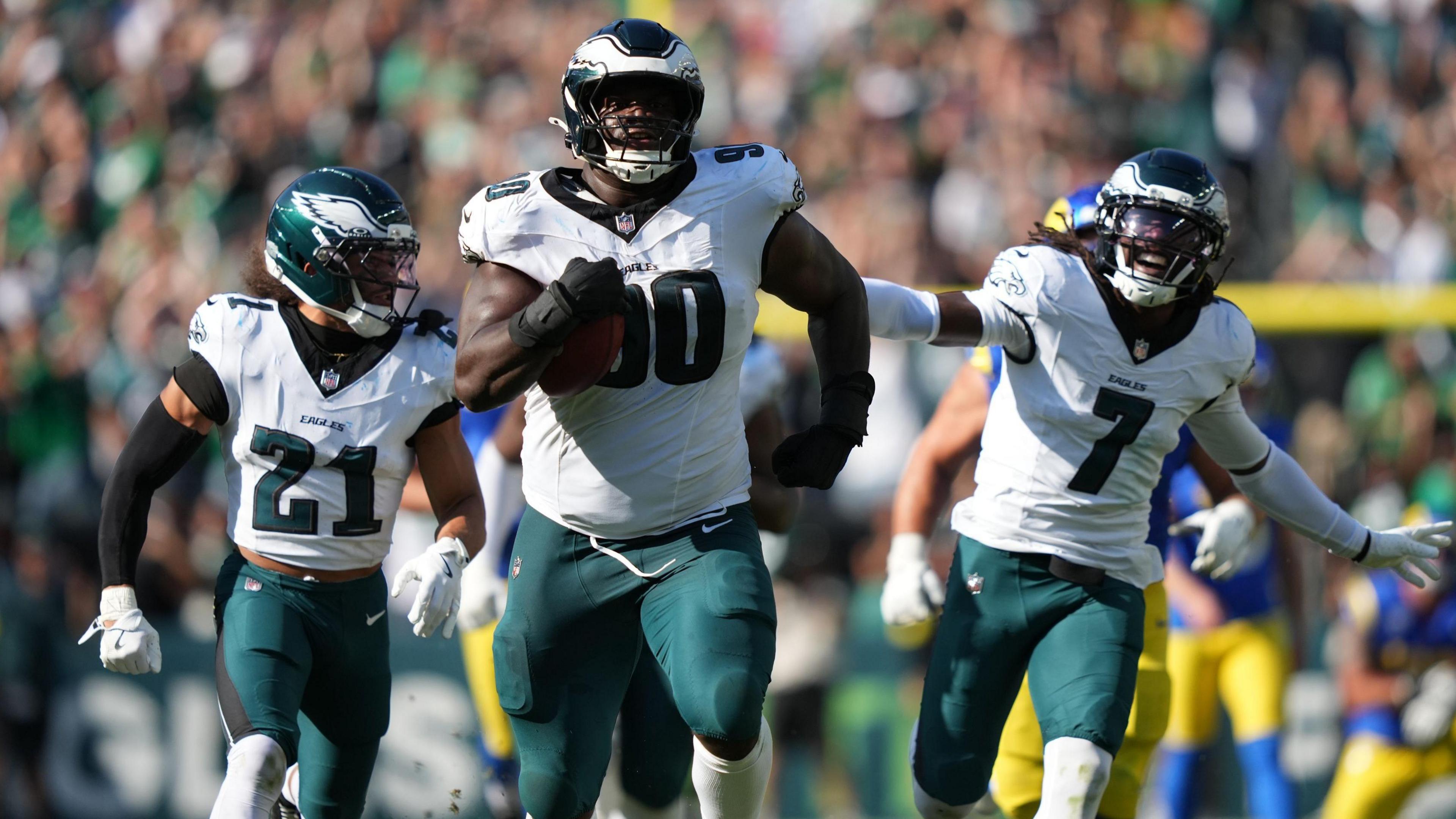 Jordan Davis of the Philadelphia Eagles runs with the ball to score a touchdown against the Los Angeles Rams