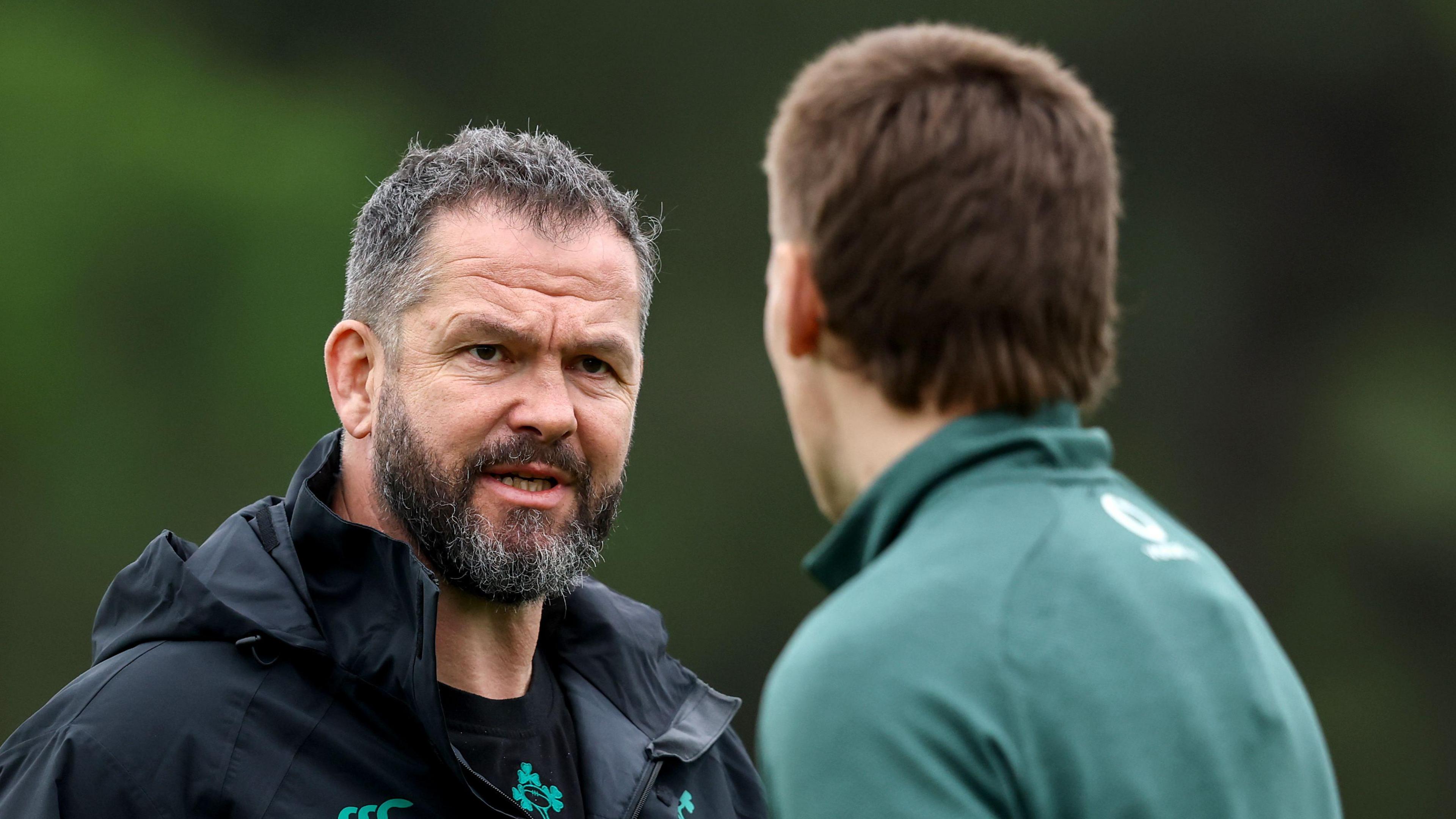 Andy Farrell speaks to Sam Prendergast in Ireland training