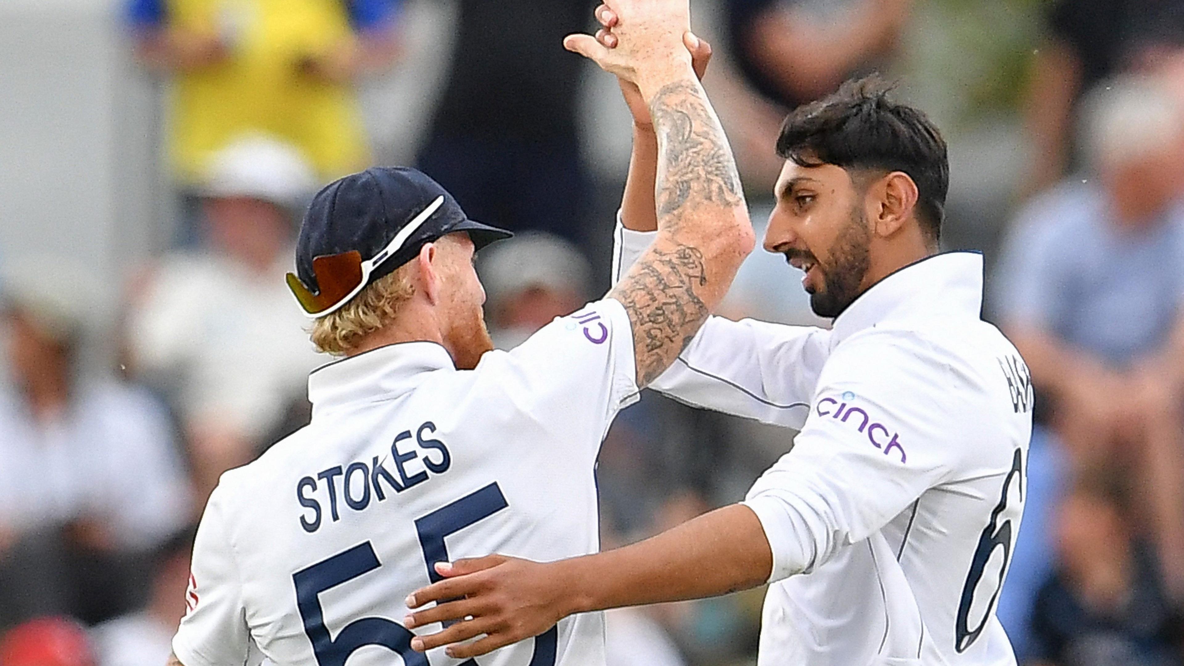 Shoaib Bashir celebrates a wicket with Ben Stokes