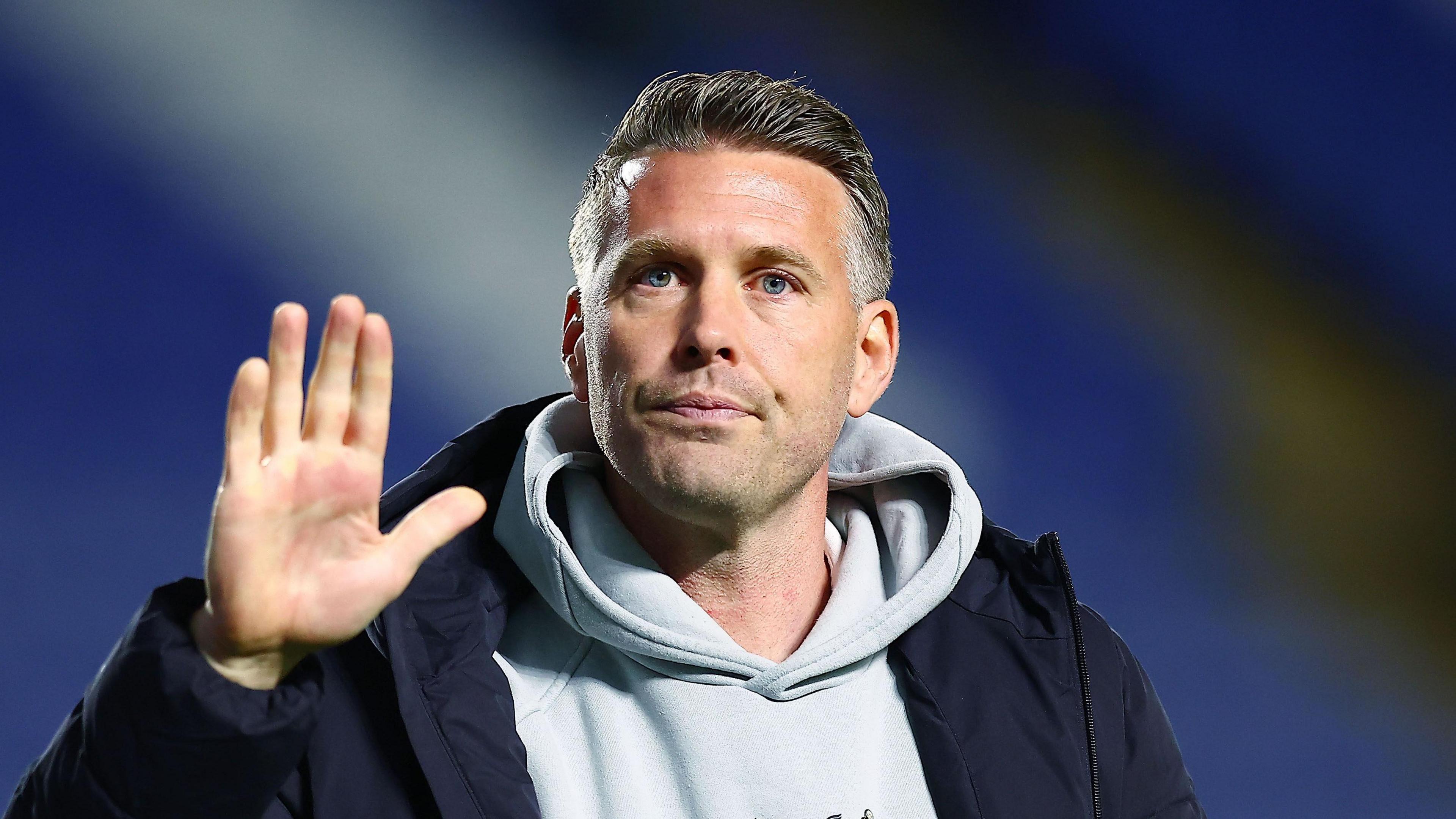 A close-up of former Middlesbrough boss Rob Edwards waving