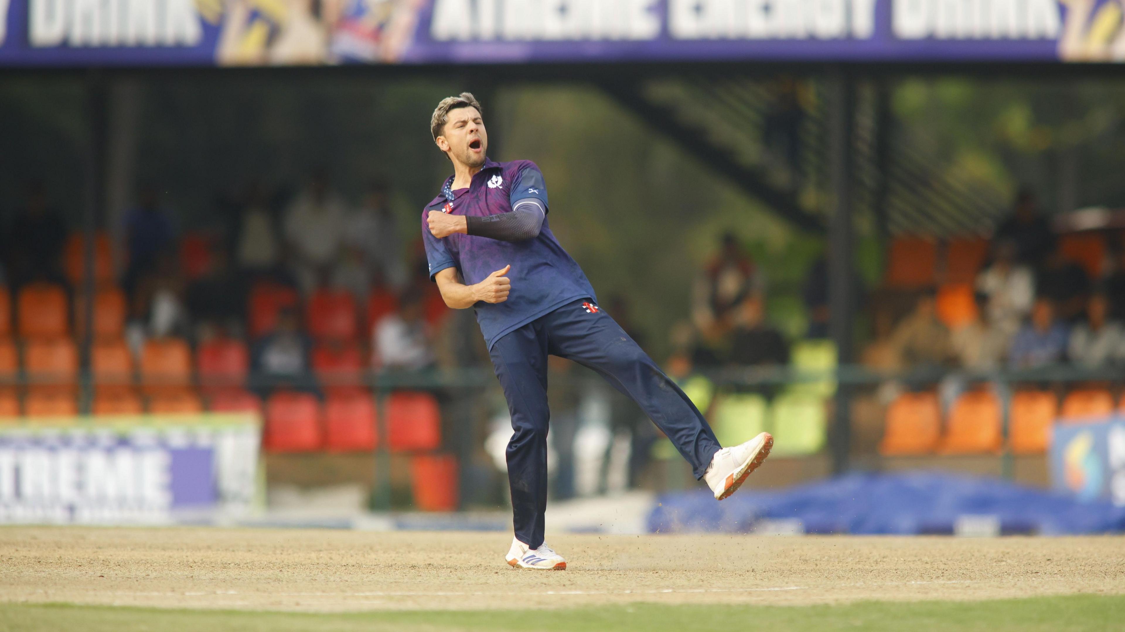 Brad Currie celebrates taking a wicket