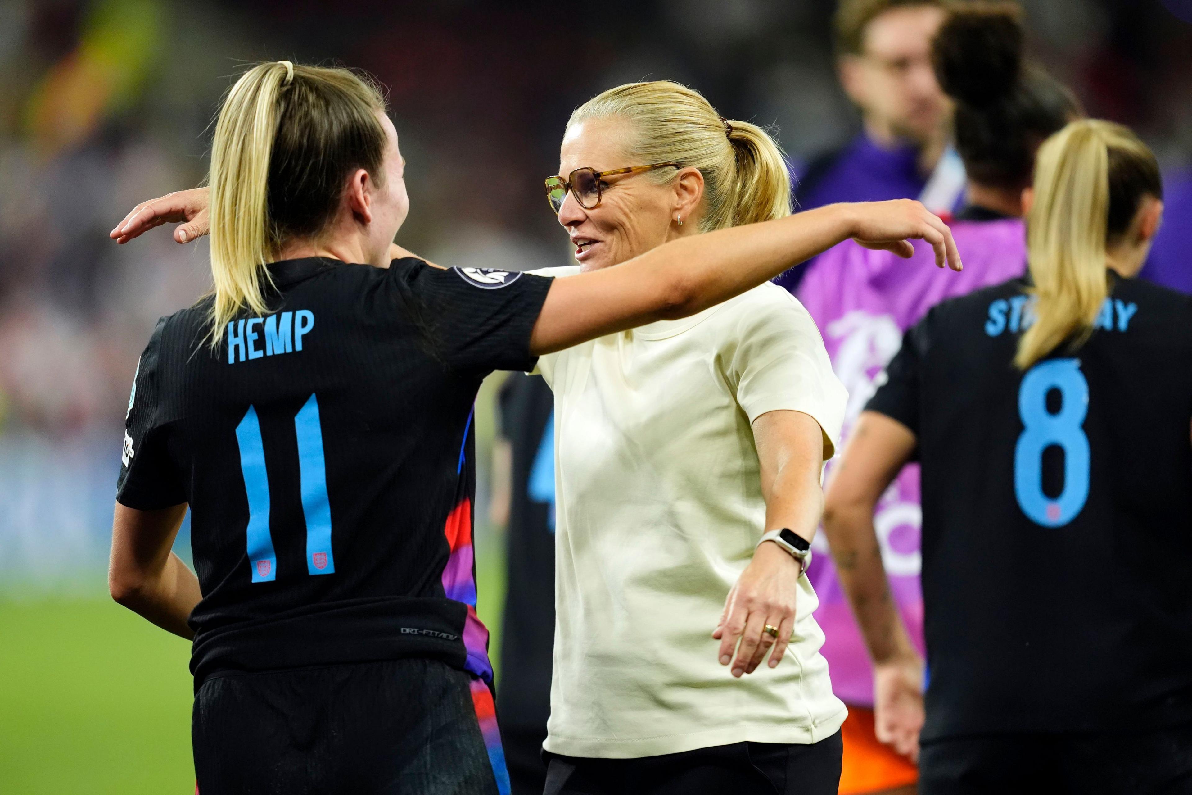 sarina wiegman hugs lauren hemp following the match