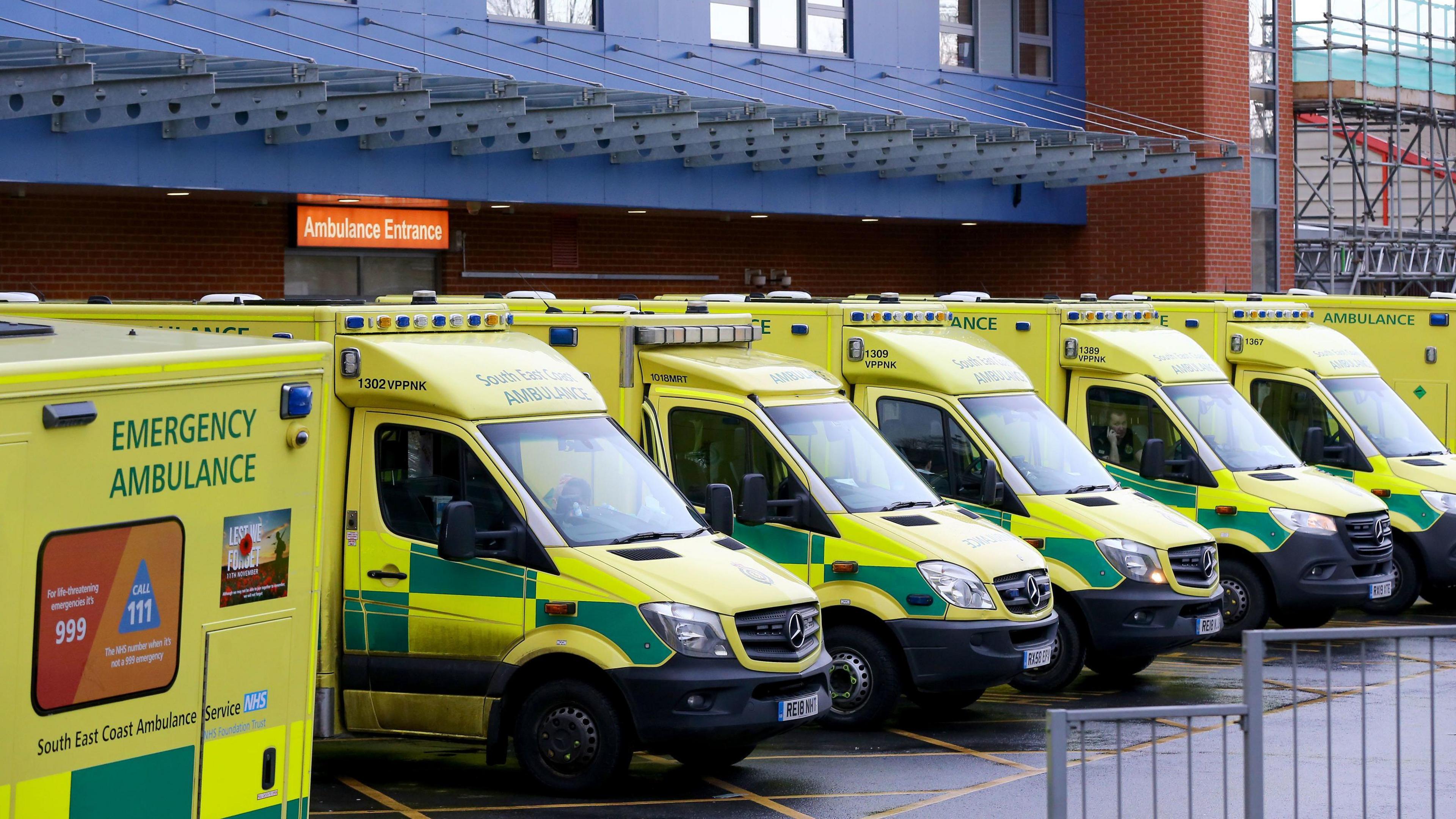 Ambulances parked outside a hospital emergency department