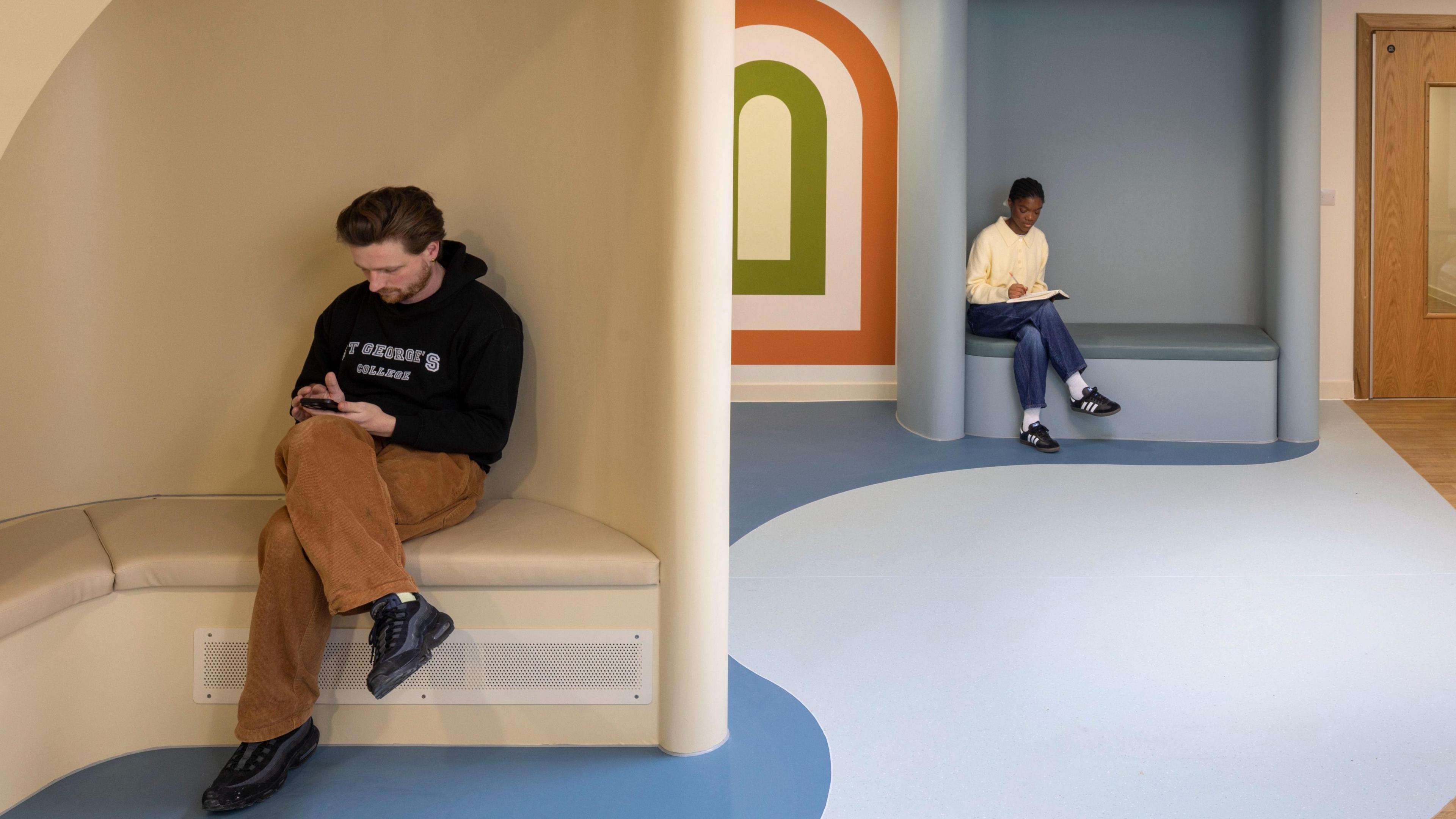 A design interpretation showing the interior of The Sett with two people sitting in booths.