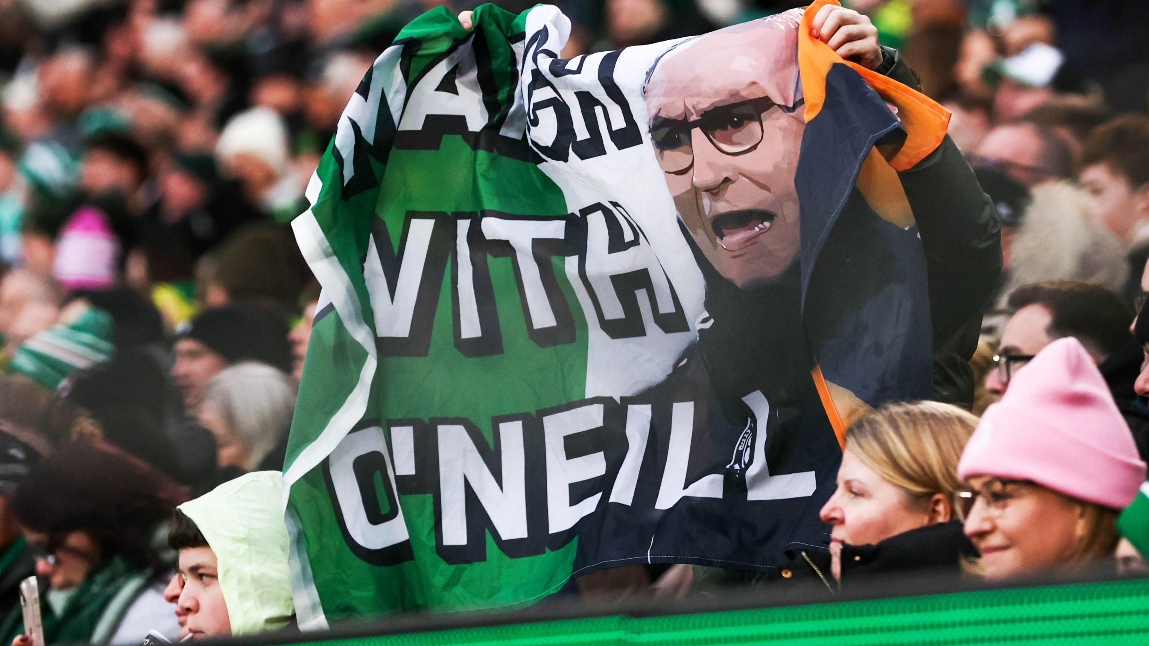 Celtic fans with a Martin O'Neill banner