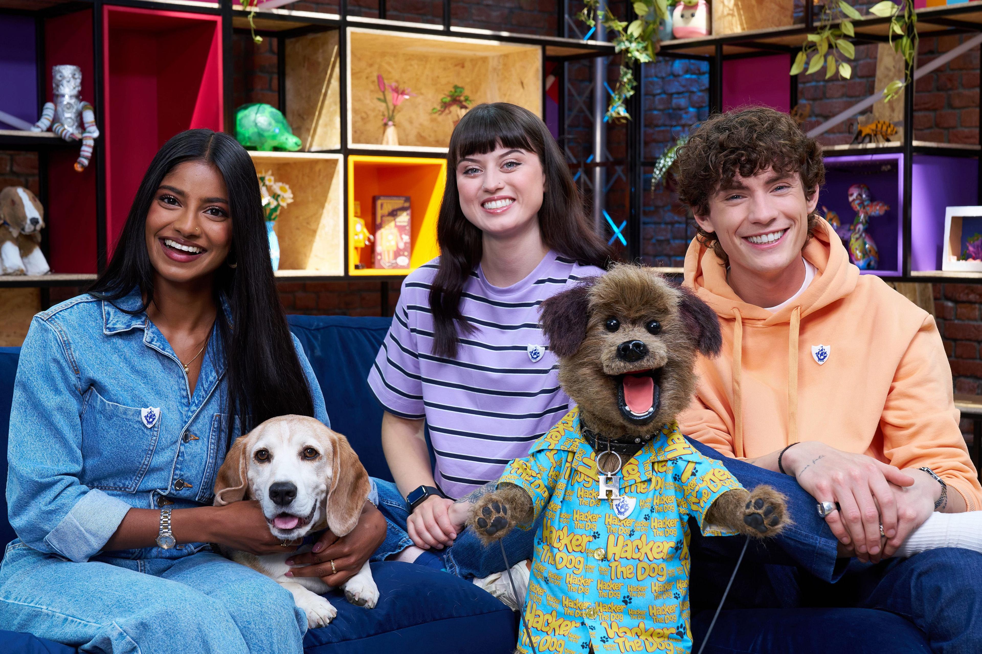 hacker smiling next to shini muthukrishnan, abby cook, henry the dog and joel mawhinney