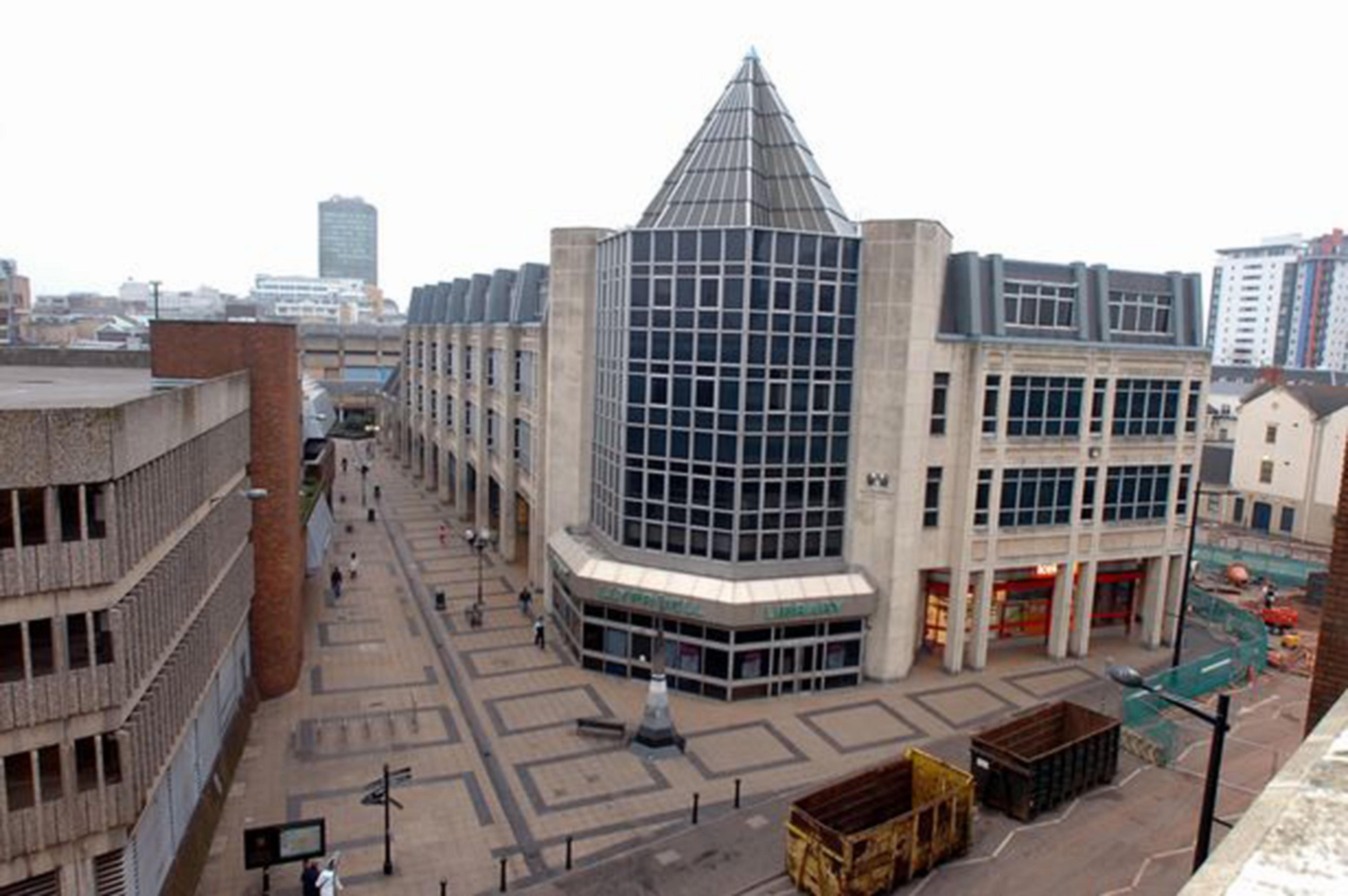 An aerial view of the old Cardiff Library, which stands several storeys high, in the middle of the city centre.