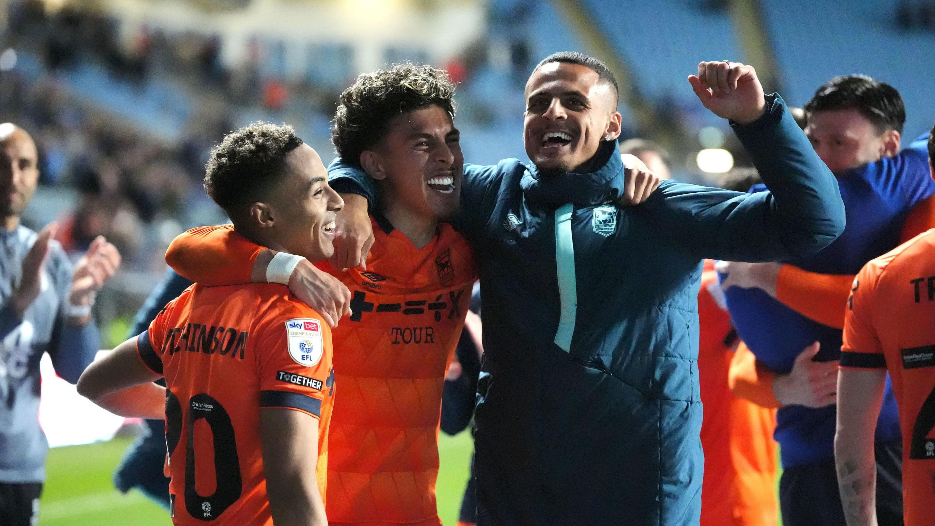 Ipswich Town's Omari Hutchinson (left) and team-mates celebrate victory after the final whistle against Coventry