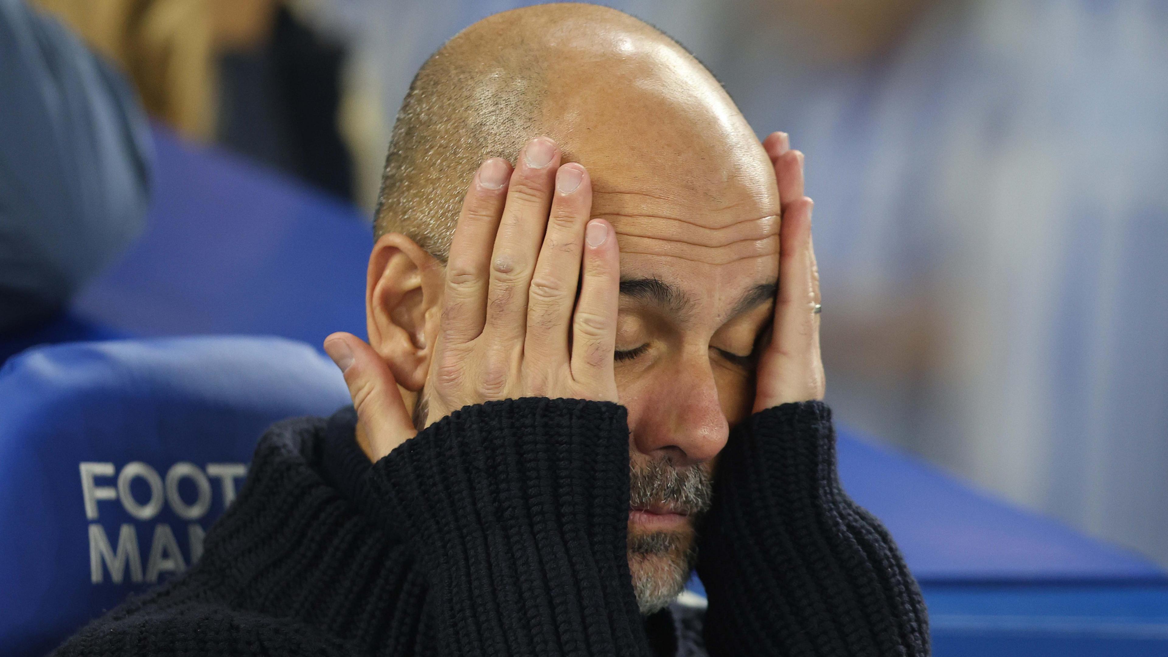 Manchester City manager Pep Guardiola reacts during their 2-1 defeat by Brighton in the Premier League