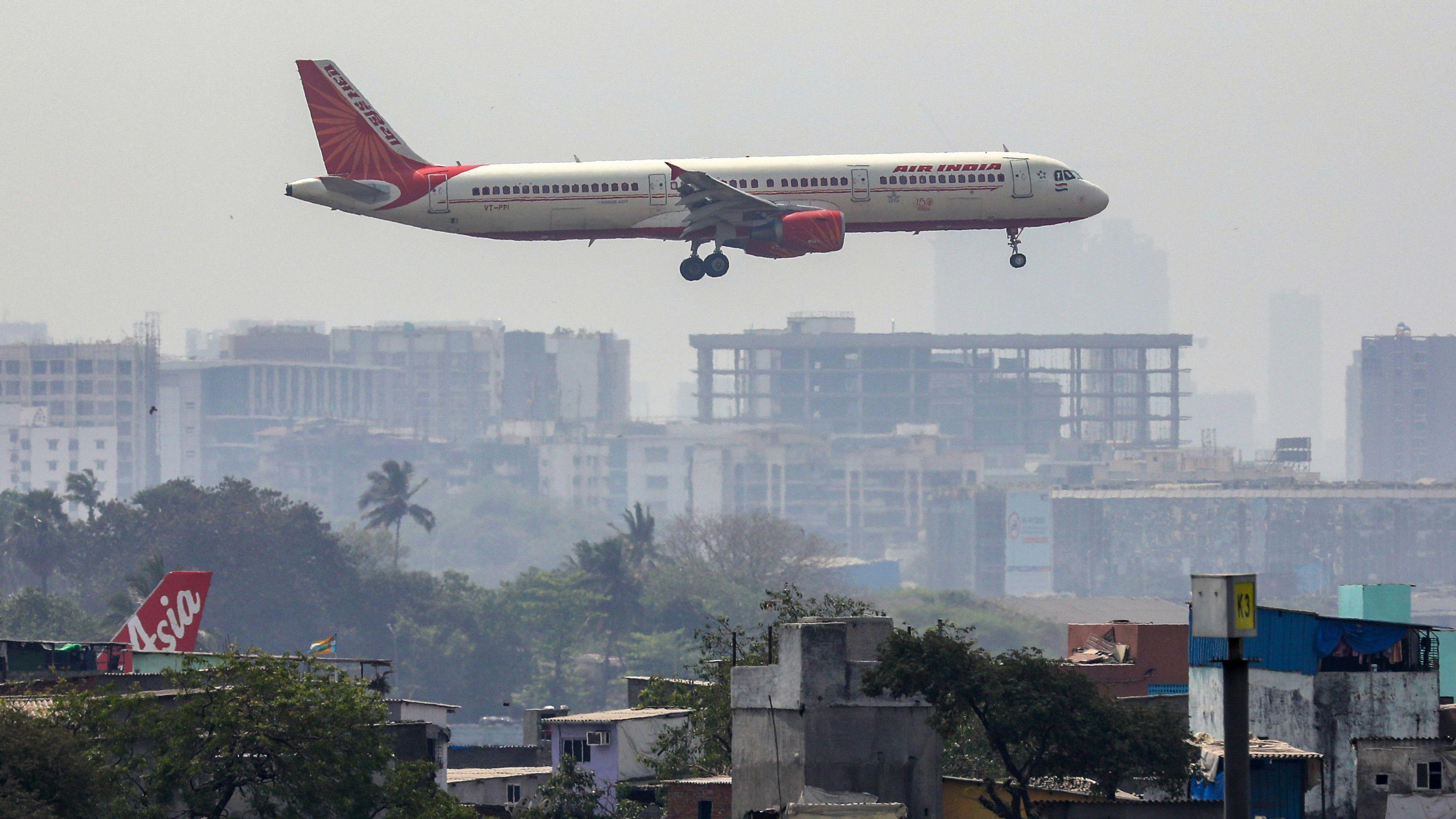 Mandatory Credit: Photo by DIVYAKANT SOLANKI/EPA-EFE/REX/Shutterstock (13778288a)
An Air India passenger prepares to land at Chhatrapati Shivaji International Airport in Mumbai, India 22 February 2023. According to Tata group, which fully owns Air India, the merger process with Vistara Airline, a joint venture between Tata Sons and Singapore Airlines, is estimated to be completed by March 2024.
Air India to begin merging process with Vistara, Mumbai - 22 Feb 2023