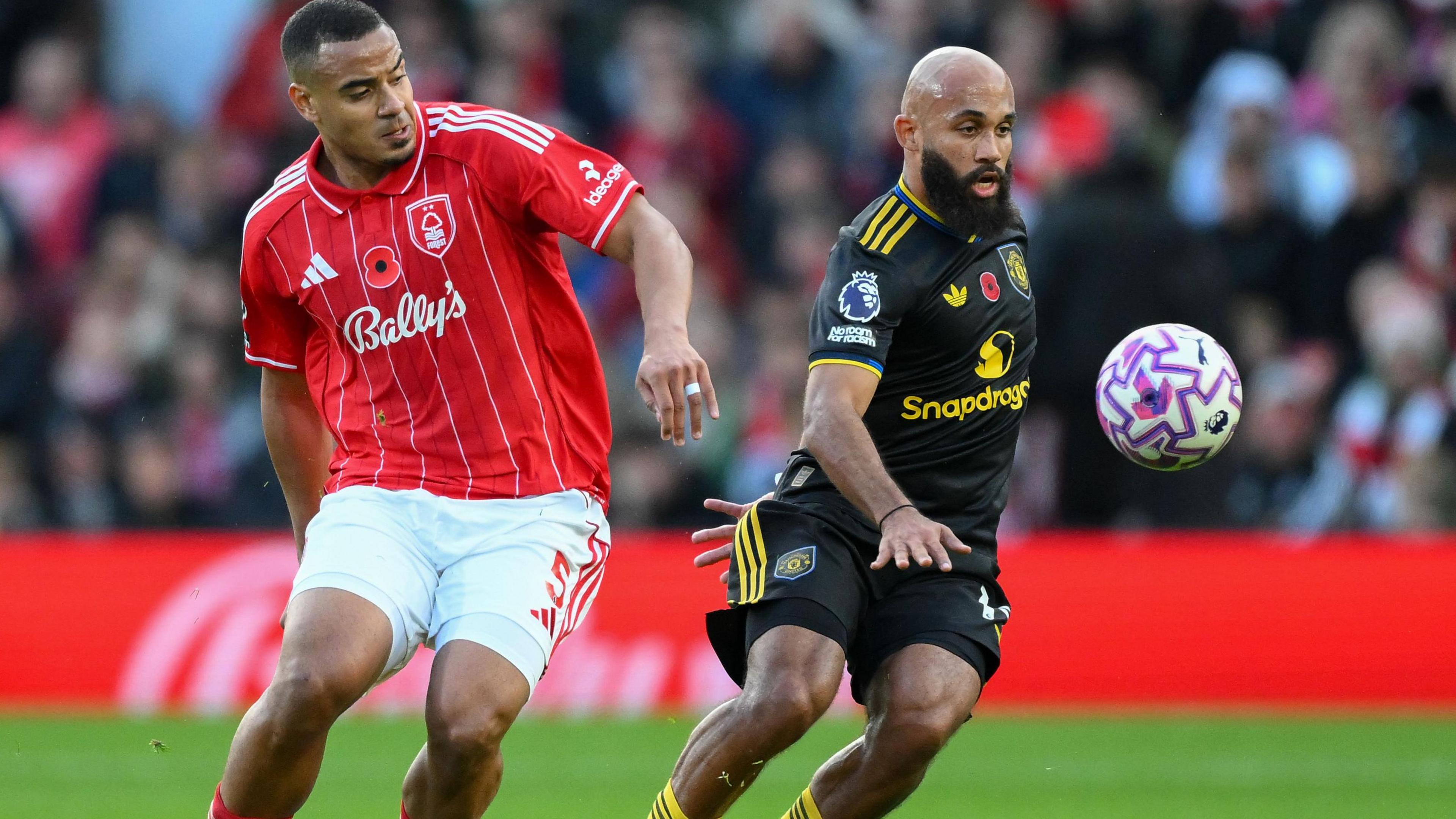 Bryan Mbeumo tries to shake off Murillo