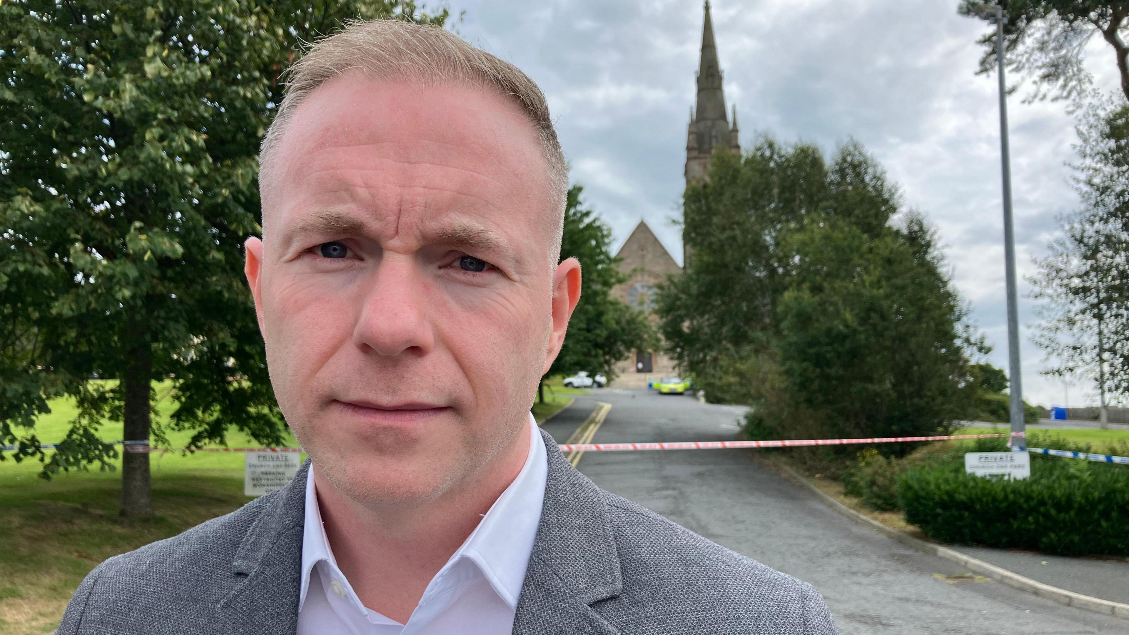 A light haired man stares straight into the camera Sinn Féin MP for South Down Chris Hazzard