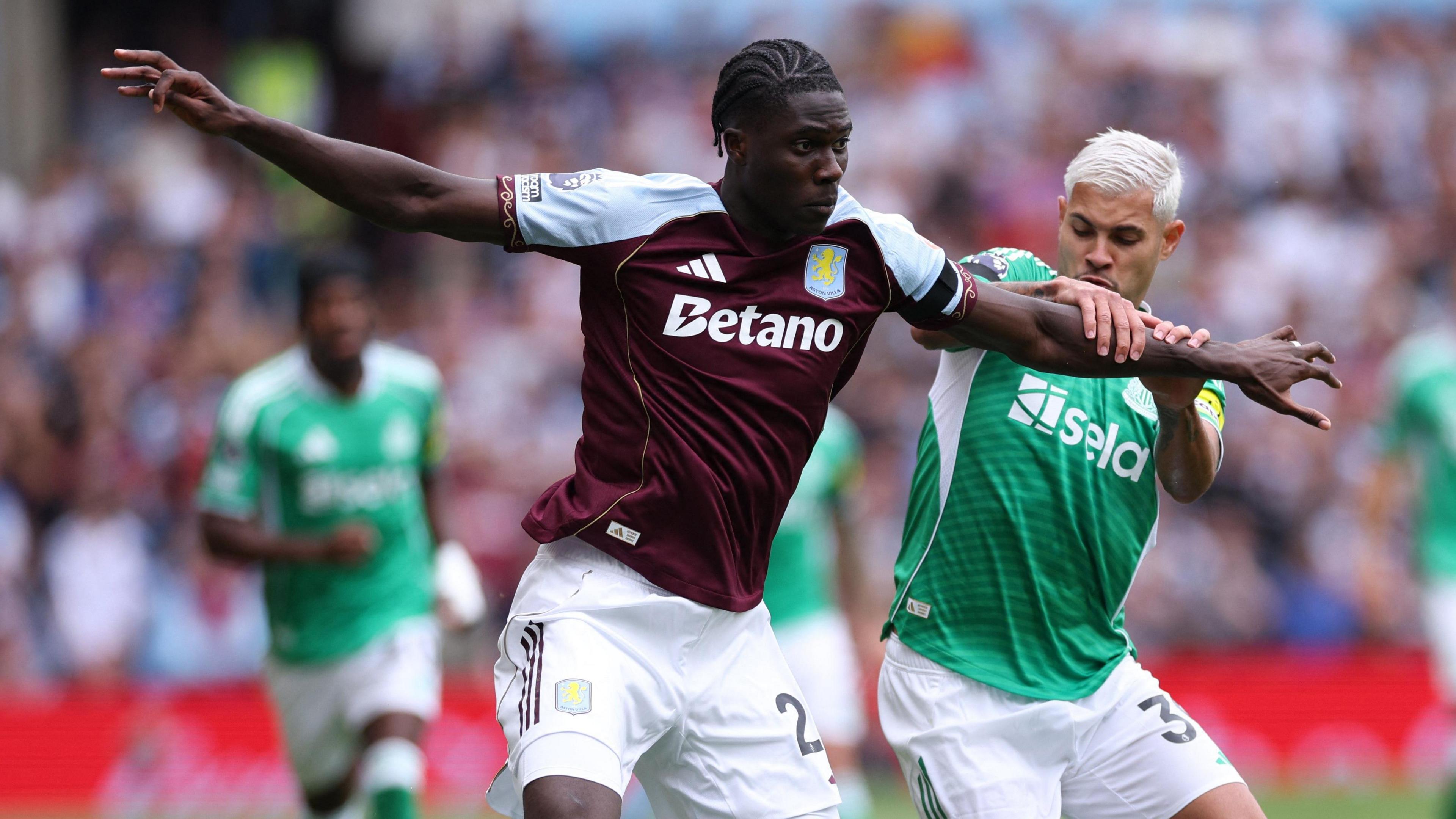 Amadou Onana battles for the ball against Newcastle 