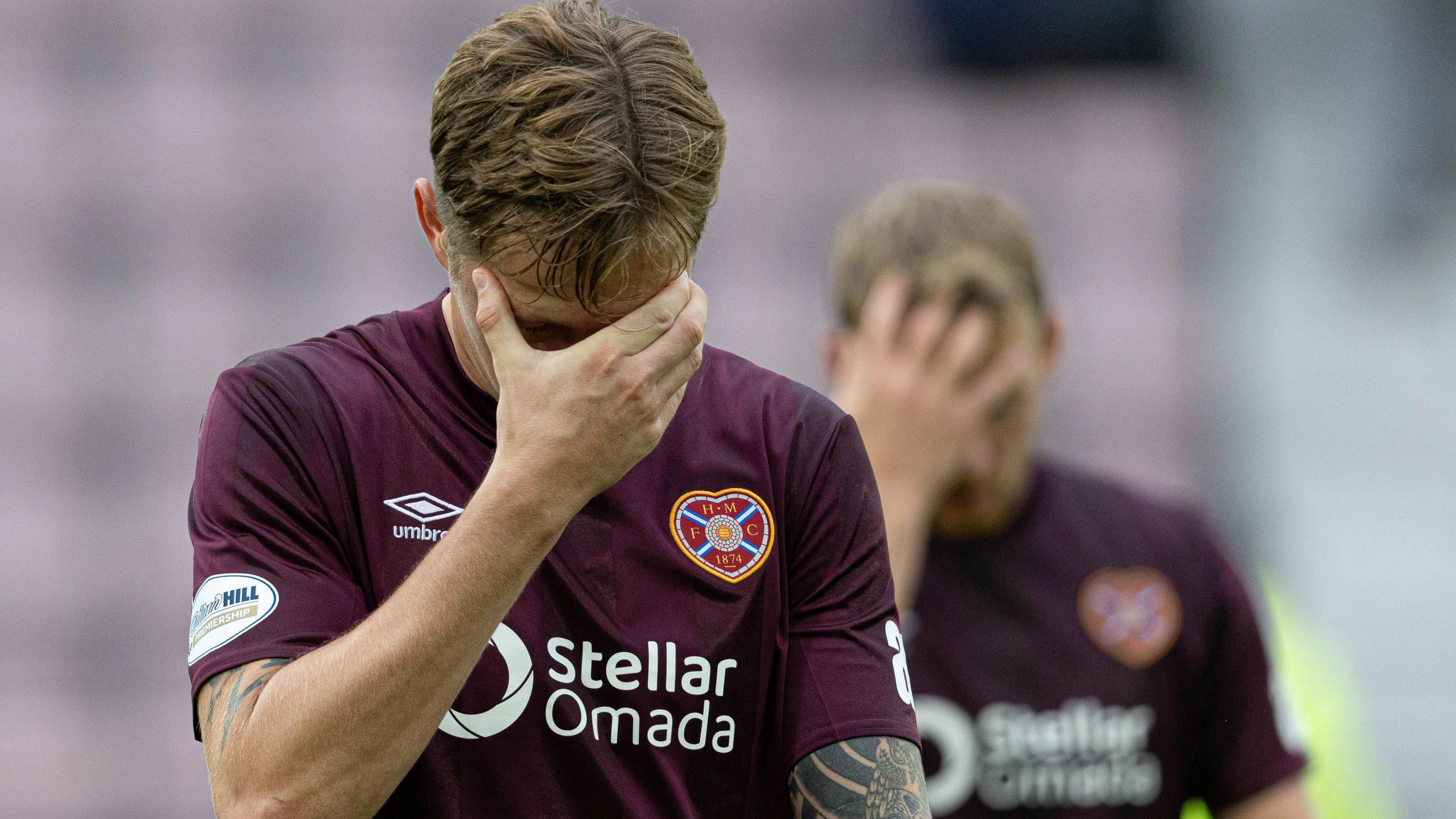 Hearts players hold their heads in their hands