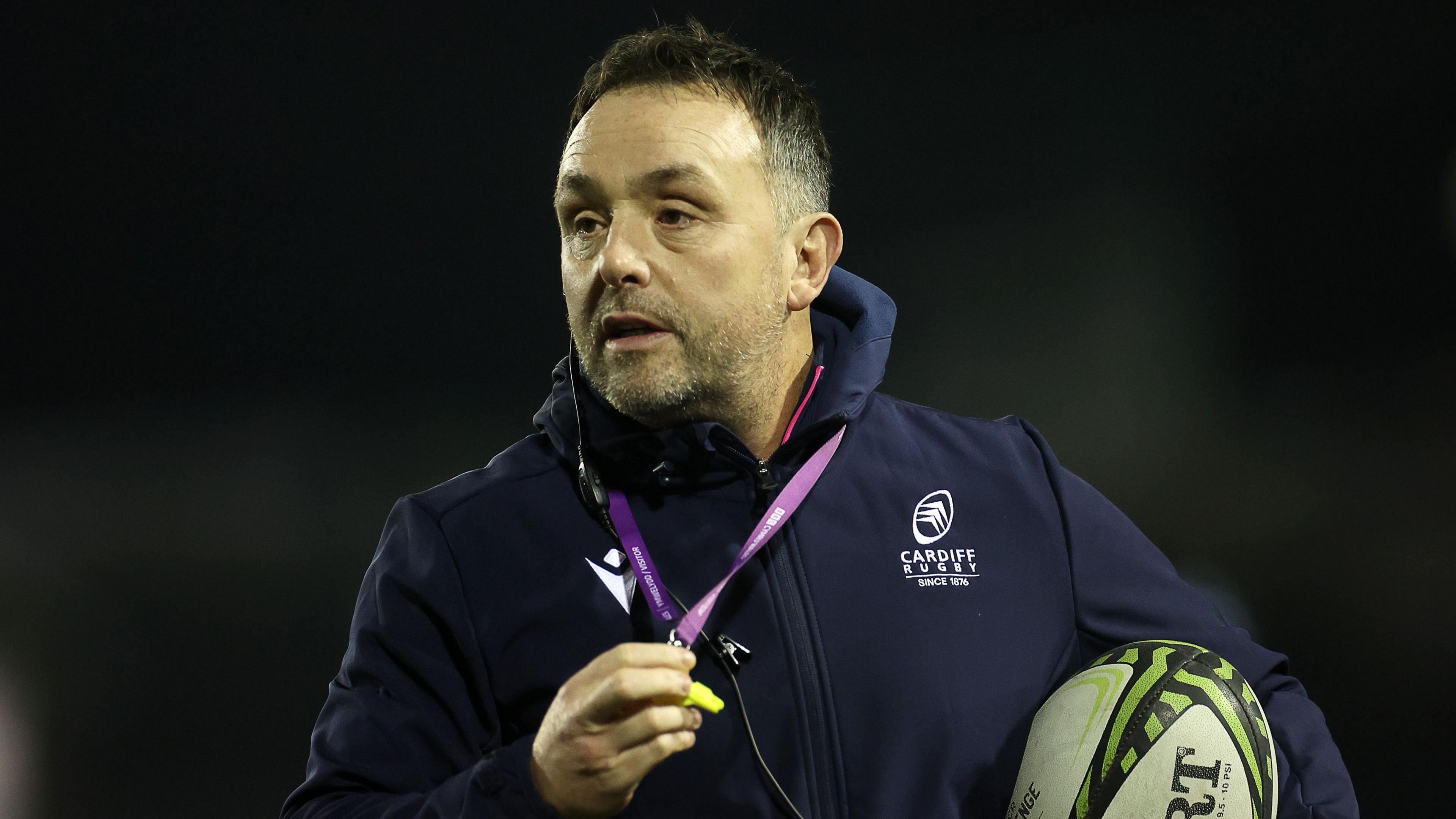 Matt Sherratt holding a rugby ball