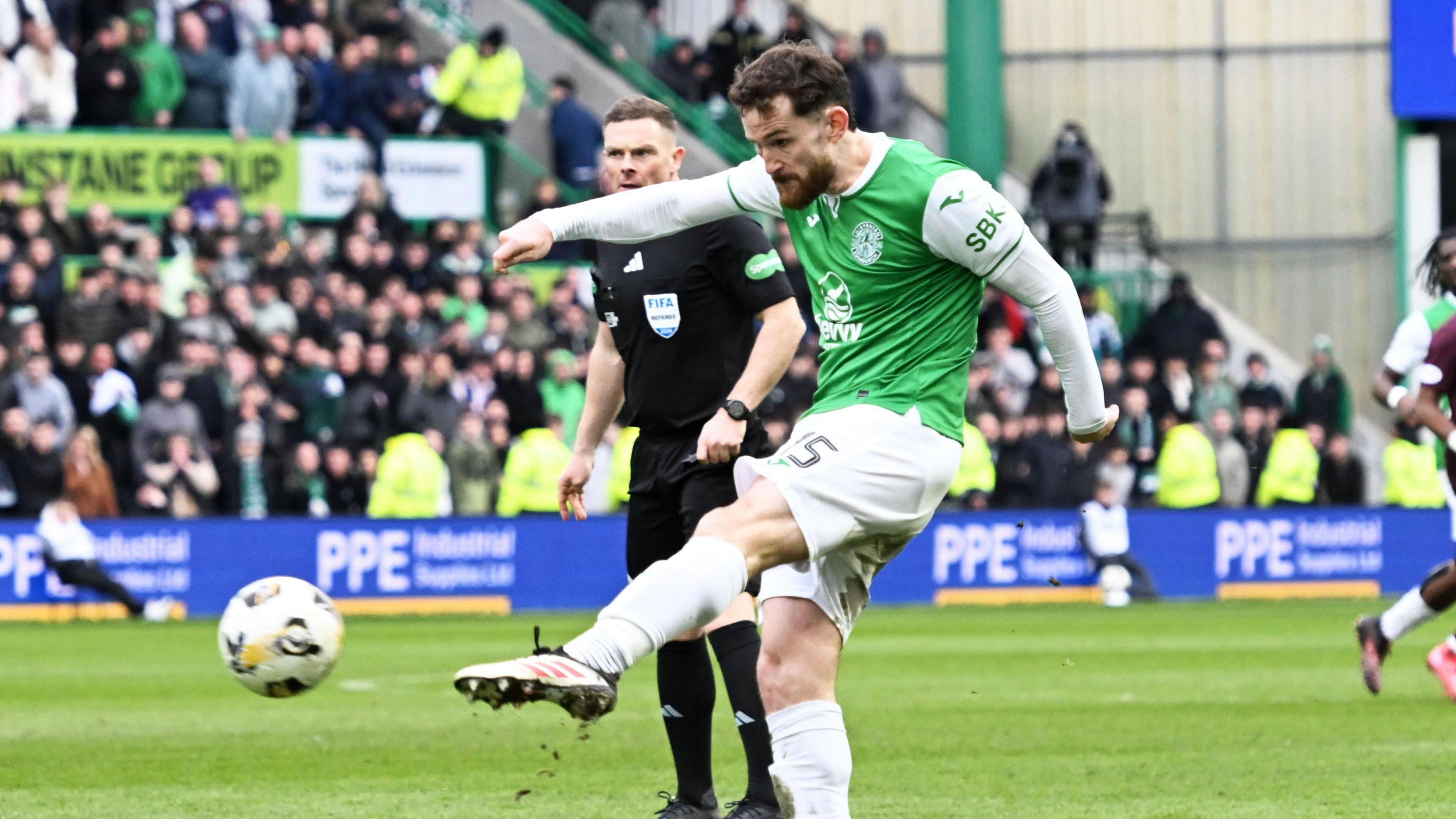 Jack Iredale scores for Hibernian against Hearts