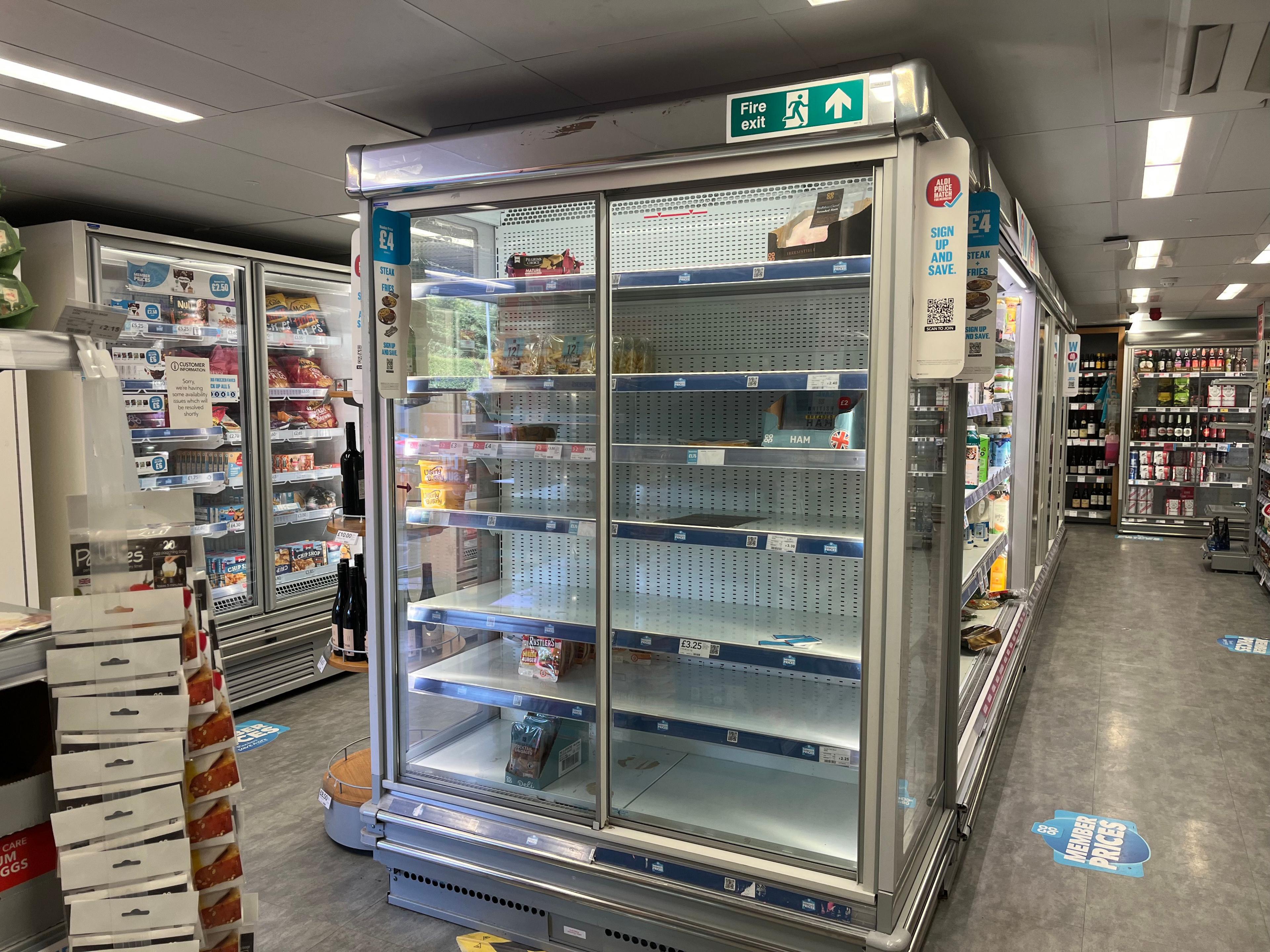 Image of an almost empty fridge in Brundall Co-op.