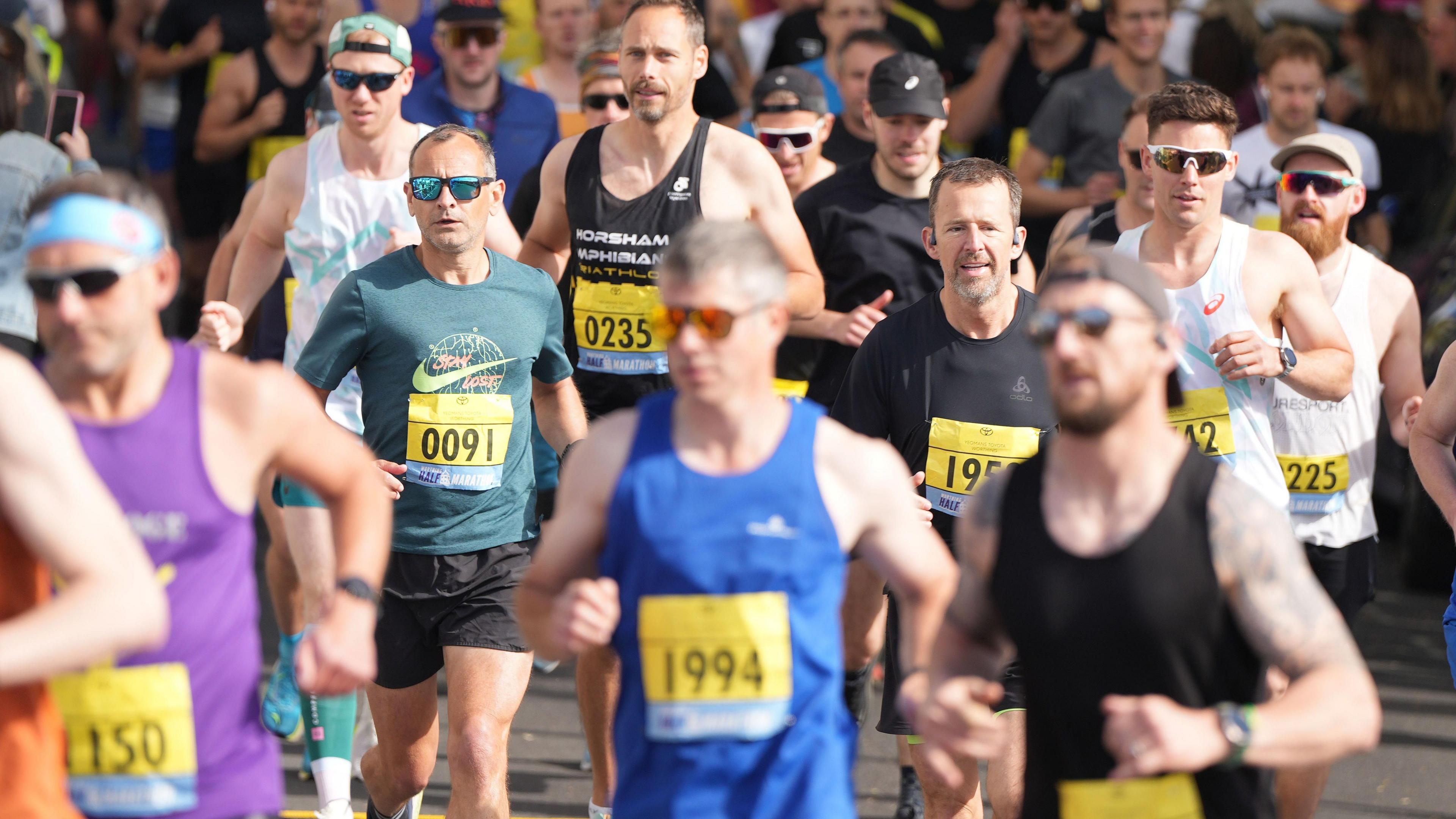 Runners in action at the Worthing Half Marathon 2025.