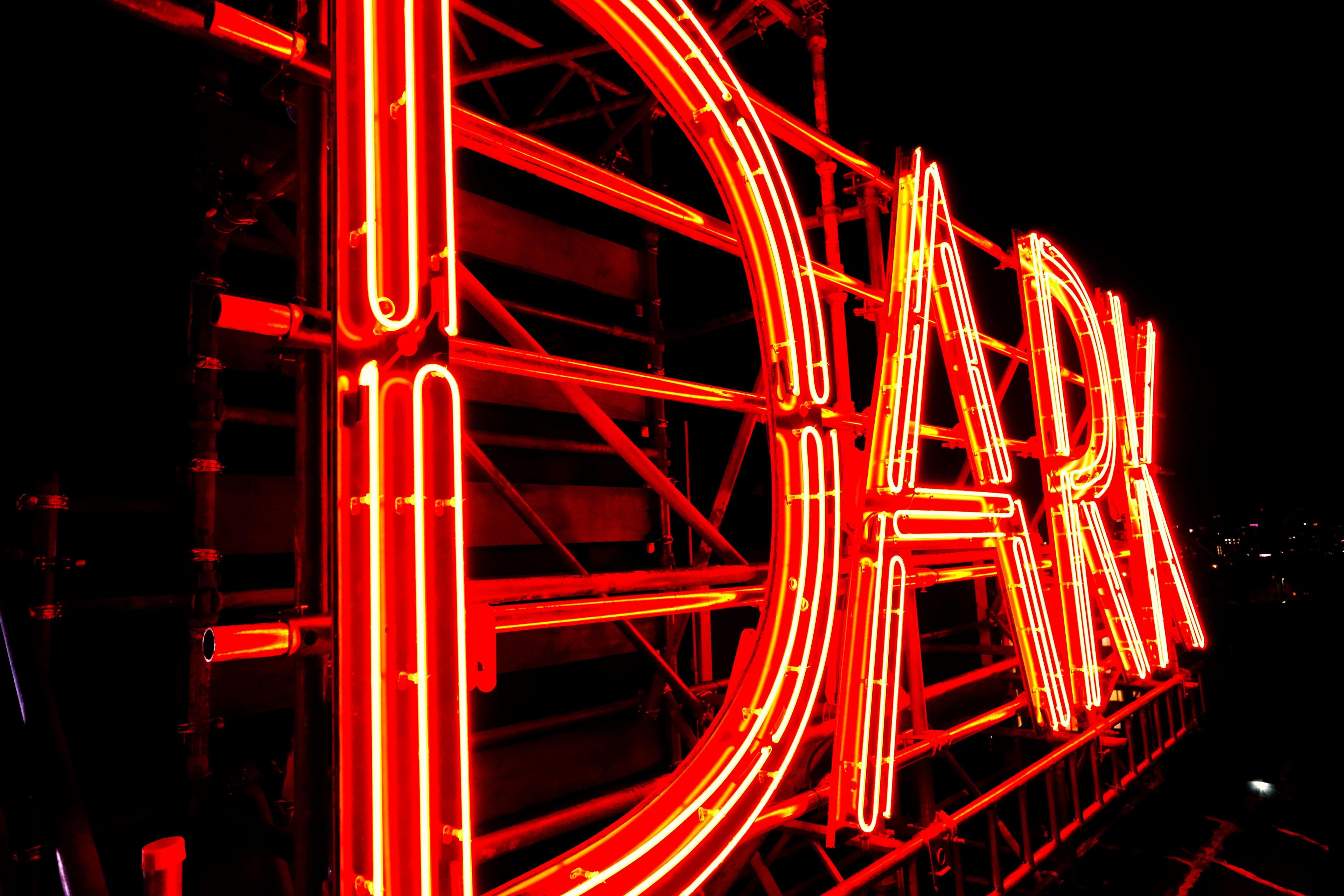 Close up of the neon sign, indestructible language. 