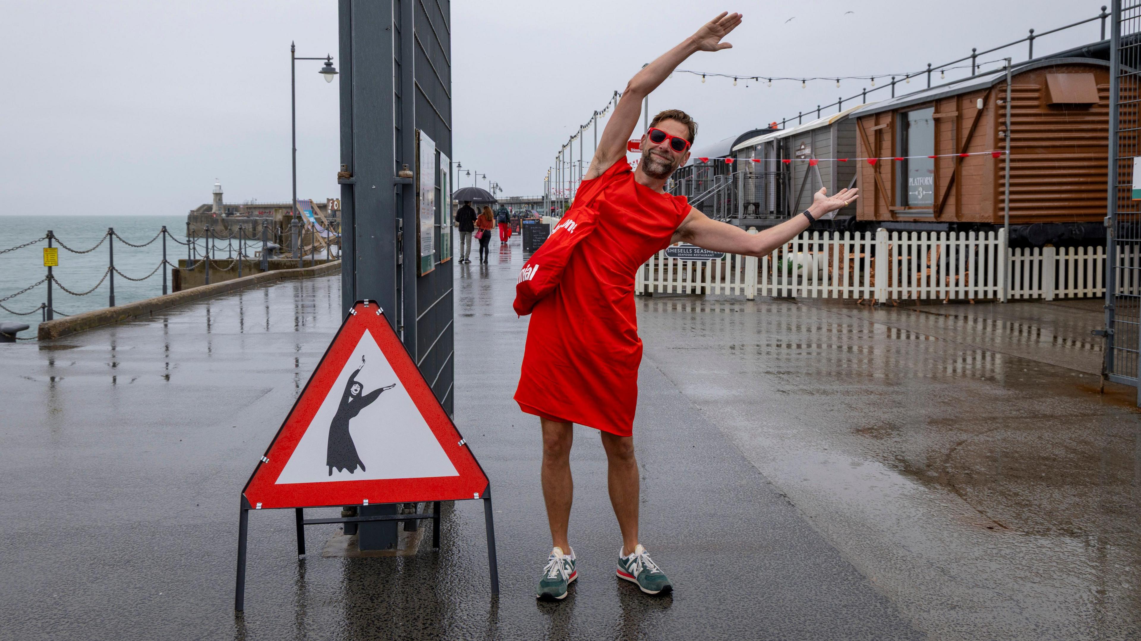 Hundreds of Kate Bush fans came together today wearing red floaty dresses on Folkestone's Harbour Arm to dance to her most iconic song, Wuthering Heights on the 20th of July 2025 in Folkestone, United Kingdom.