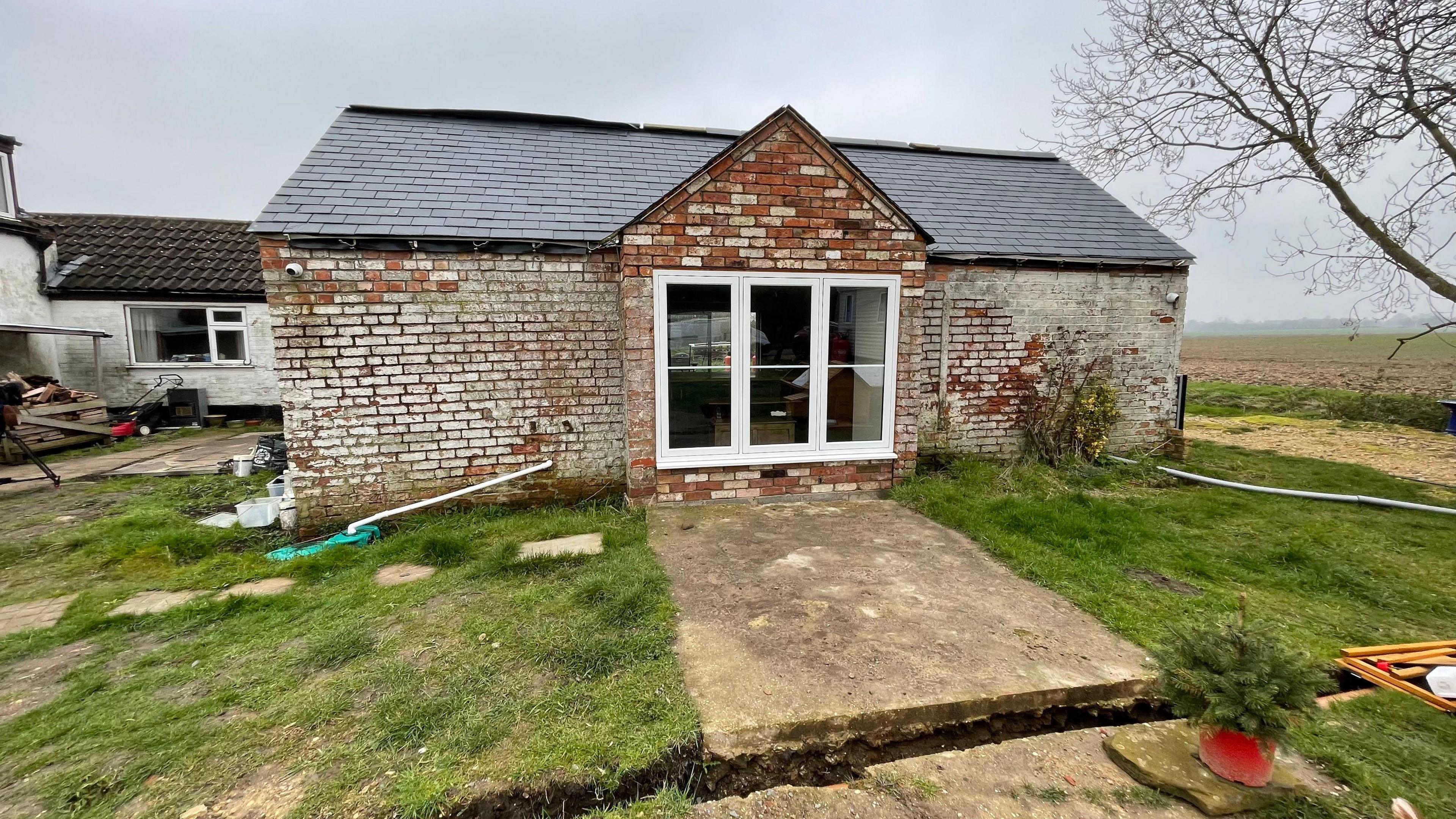 The exterior of a property damaged by flooding