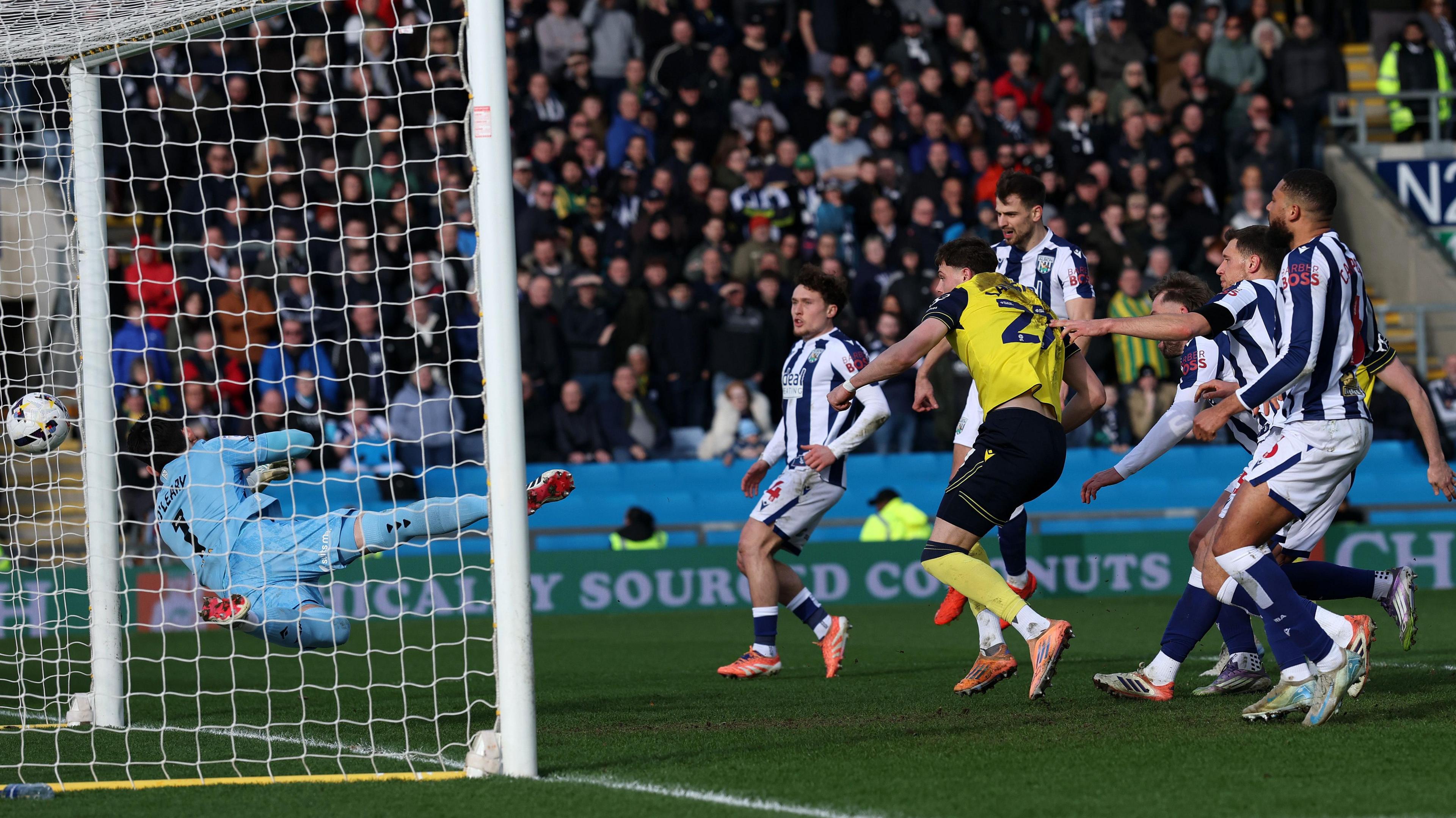 Will Lankshear heads Oxford United into a 2-0 lead against West Brom