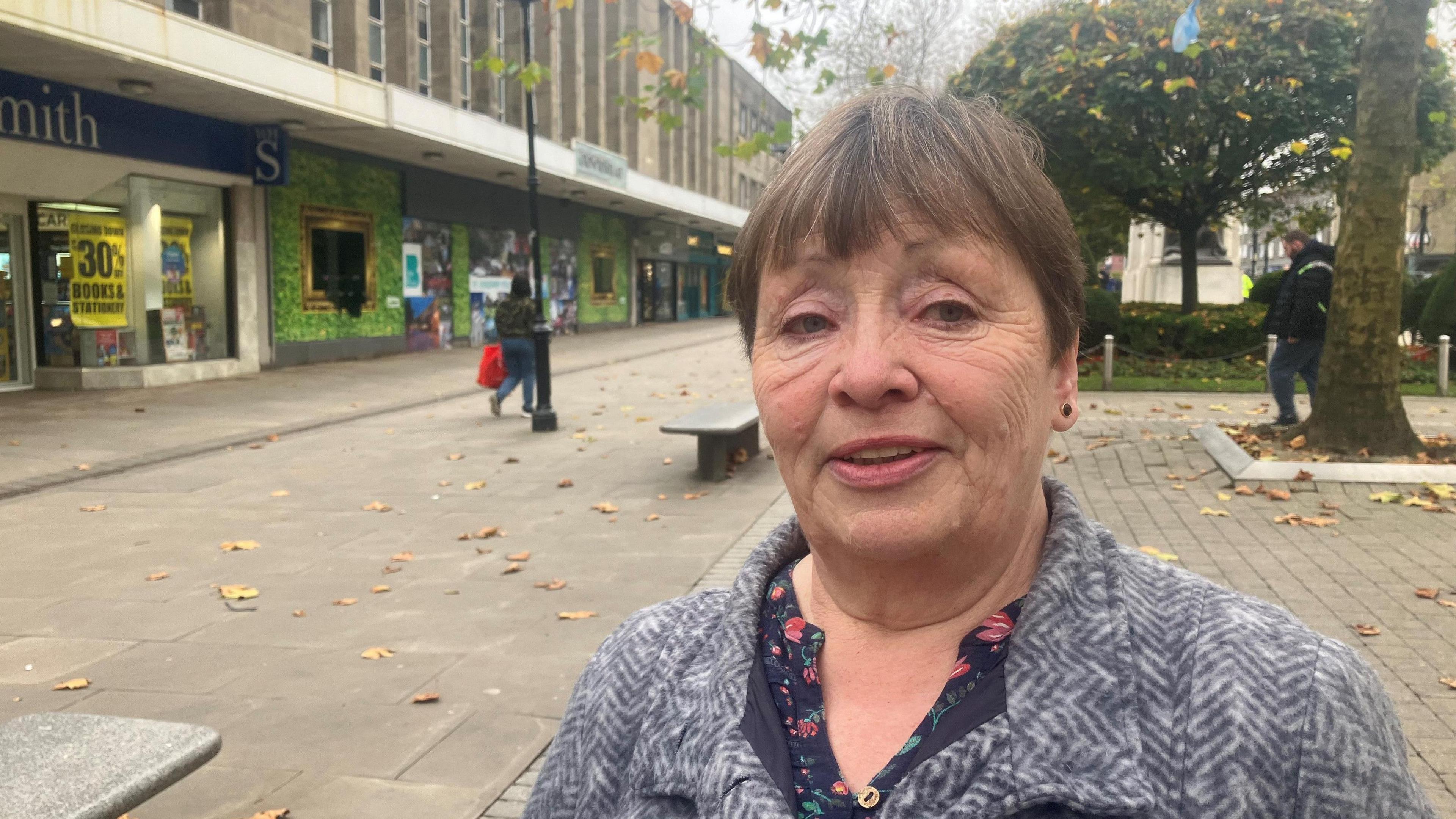 Photograph of a woman shopping in Victoria Square in Bolton town centre