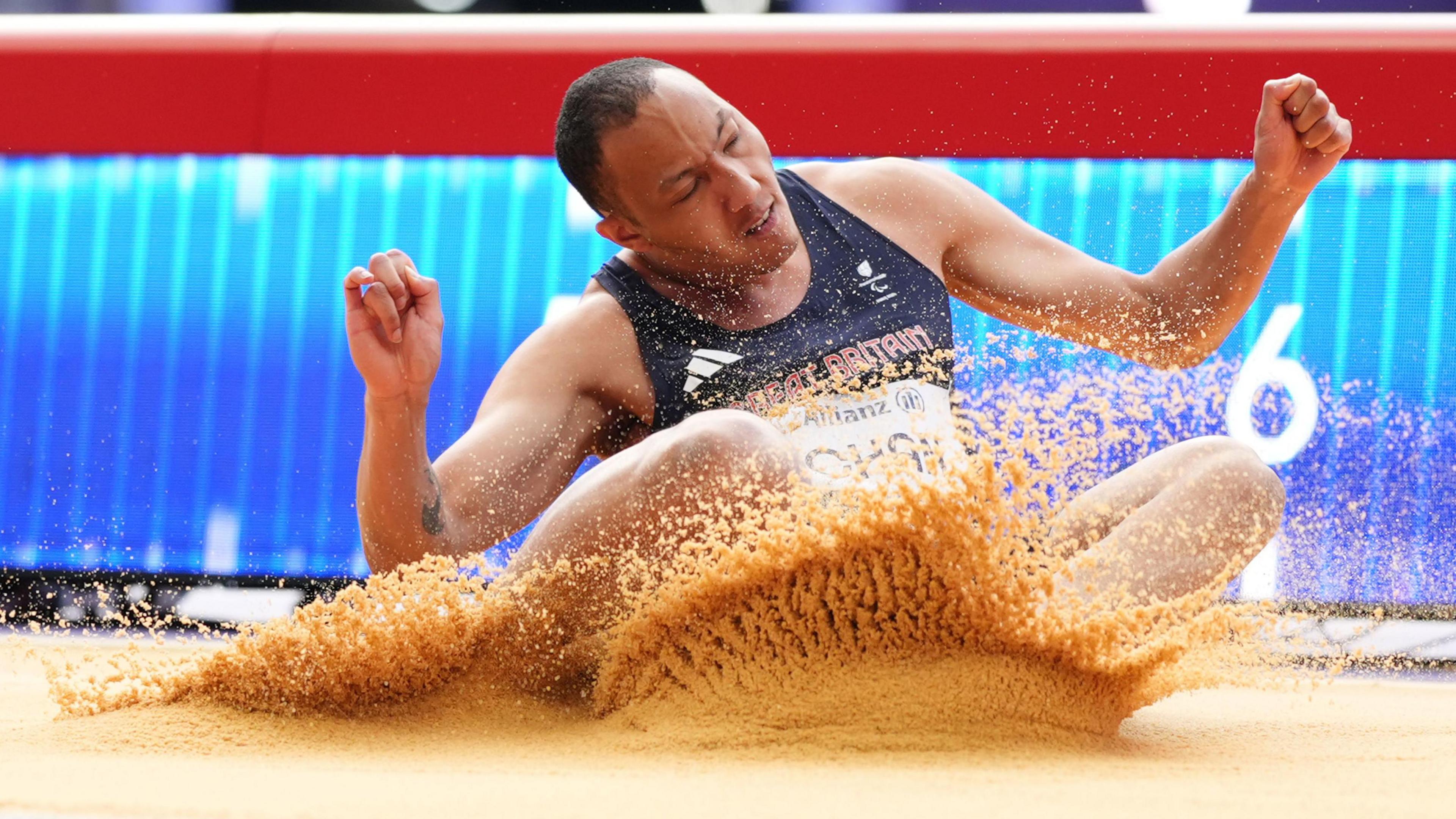 Karmin Chan lands in the long jump pit at the Paris Paralympics