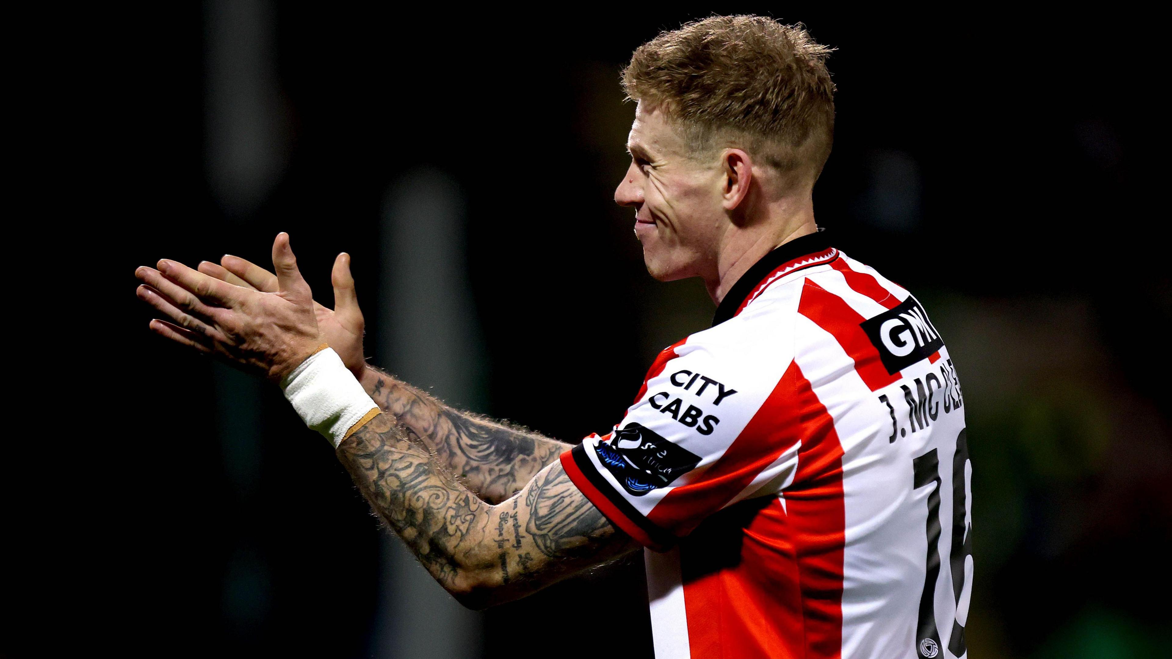 James McClean sarcastically applauds the opposition fans after setting up the winning goal during Derry City's 1-0 win over Shamrock Rovers 
