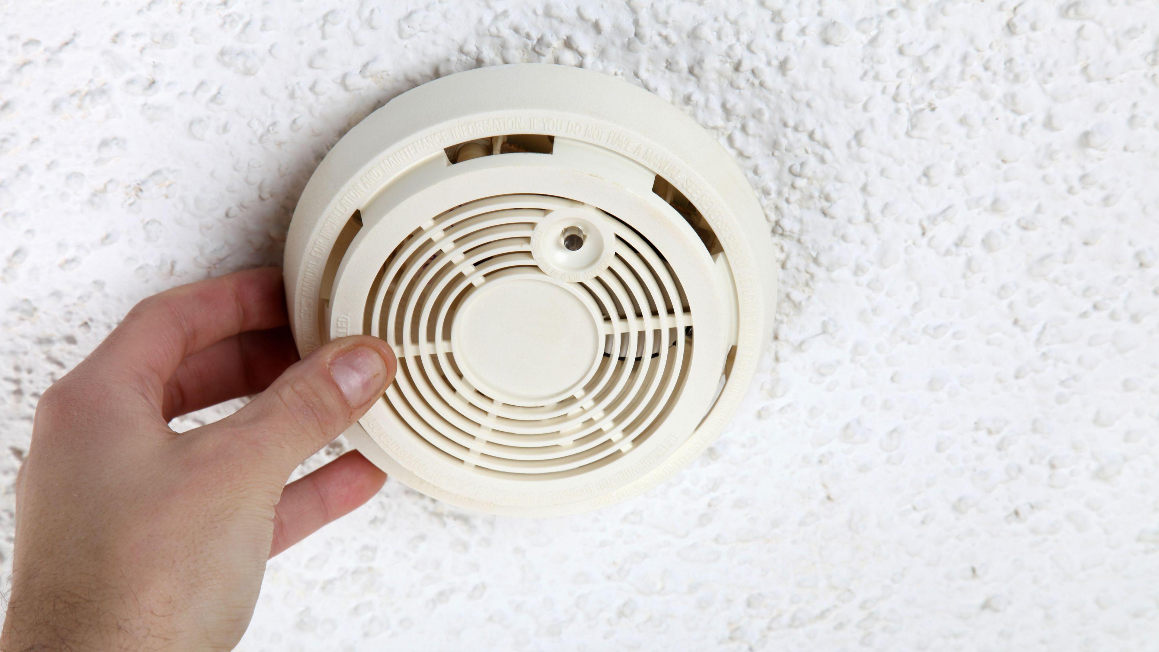 Hand Opening Smoke Detector for Maintenance. 