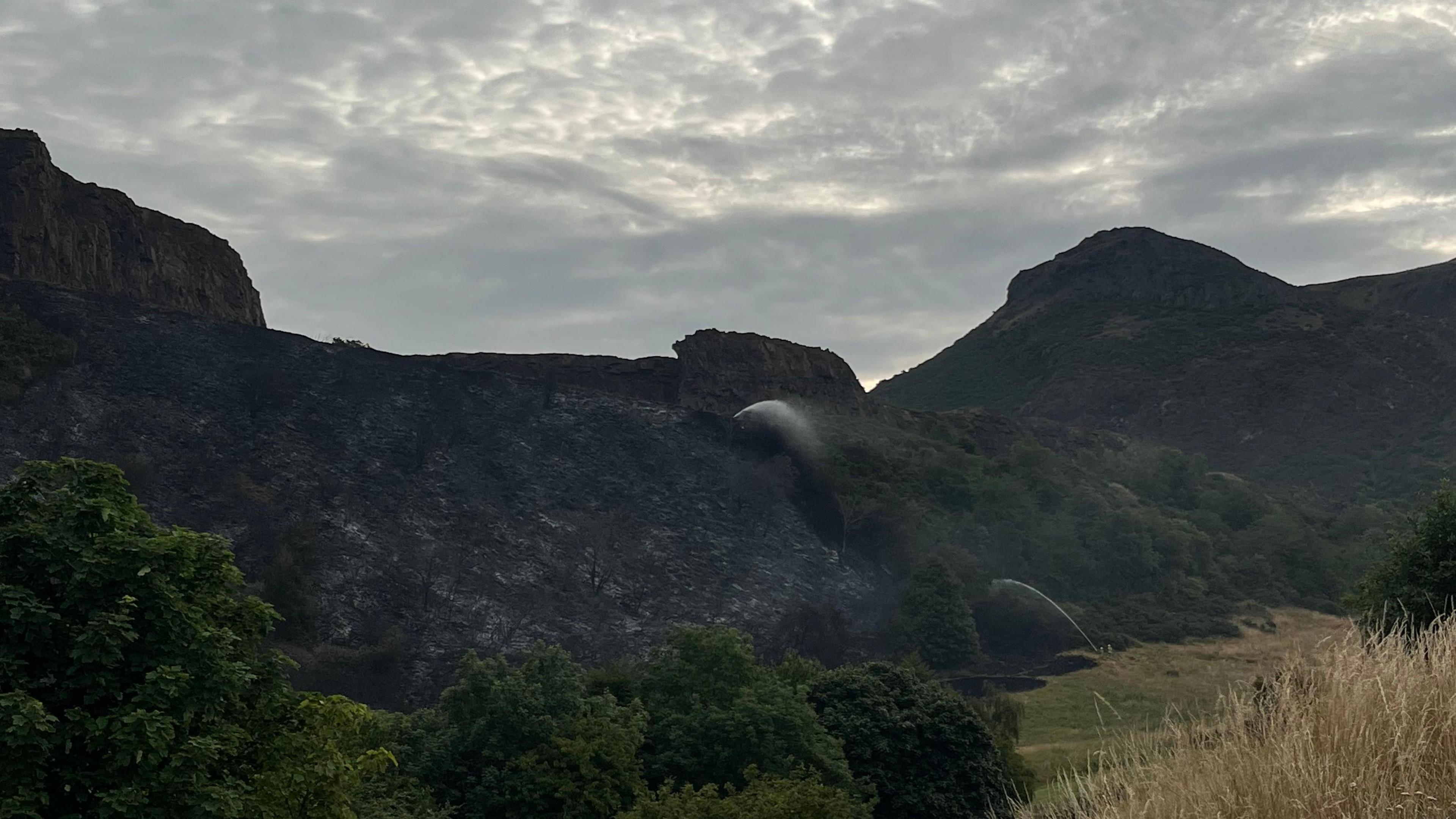Burnt vegetation along Salisbury Crags.