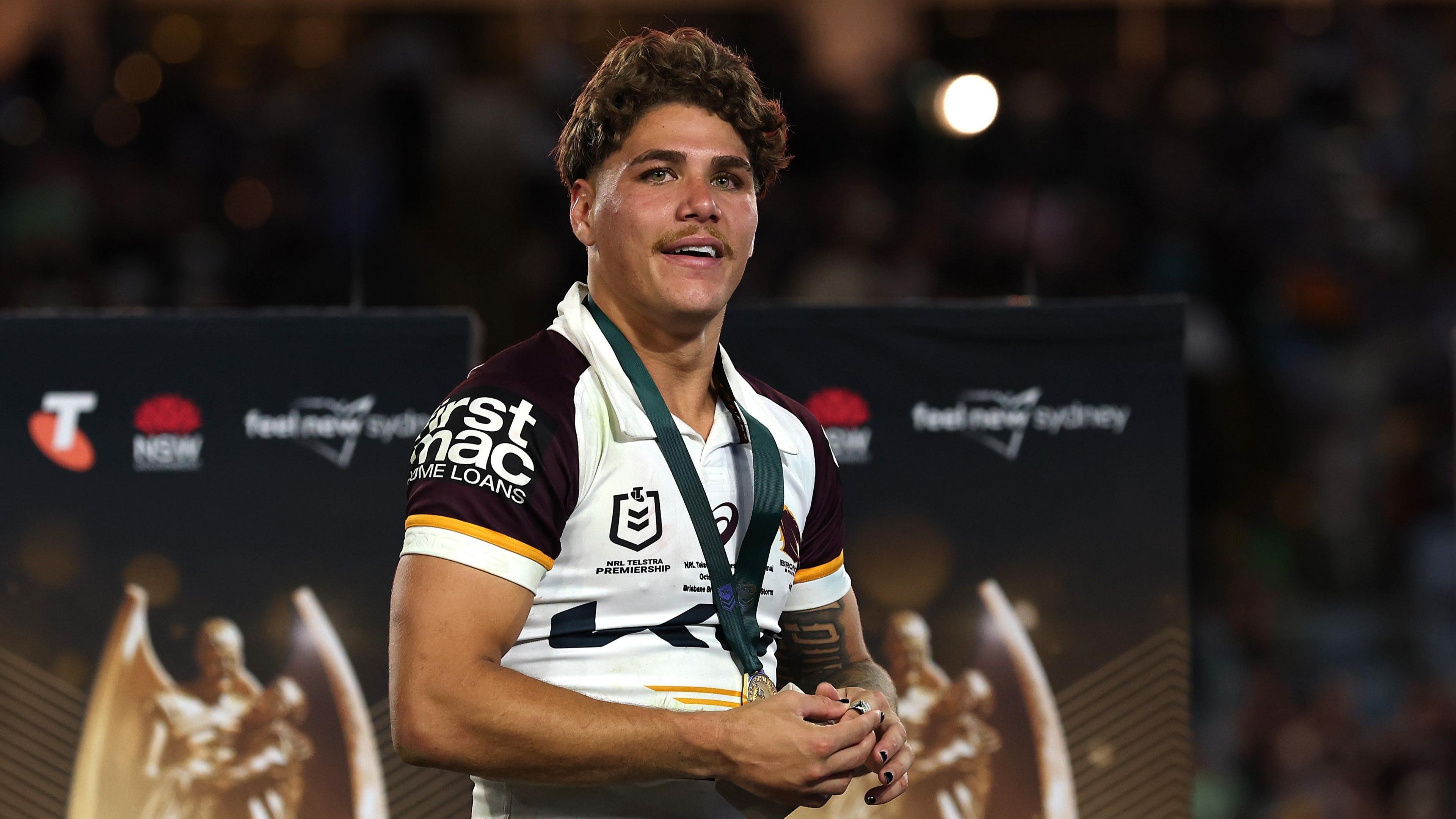 Brisbane Broncos full-back Reece Walsh with a medal around his neck