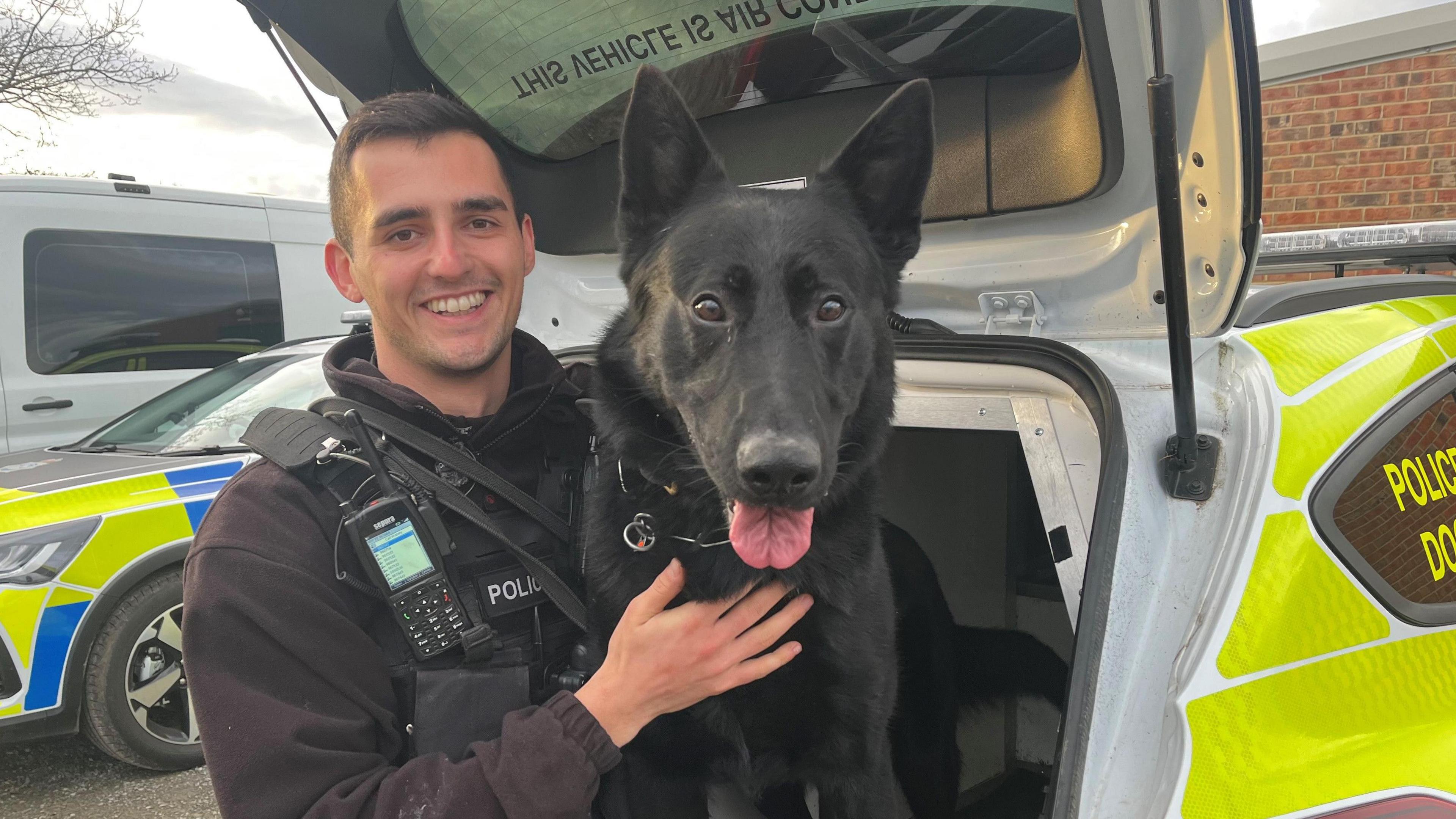 A police dog handler with his dog