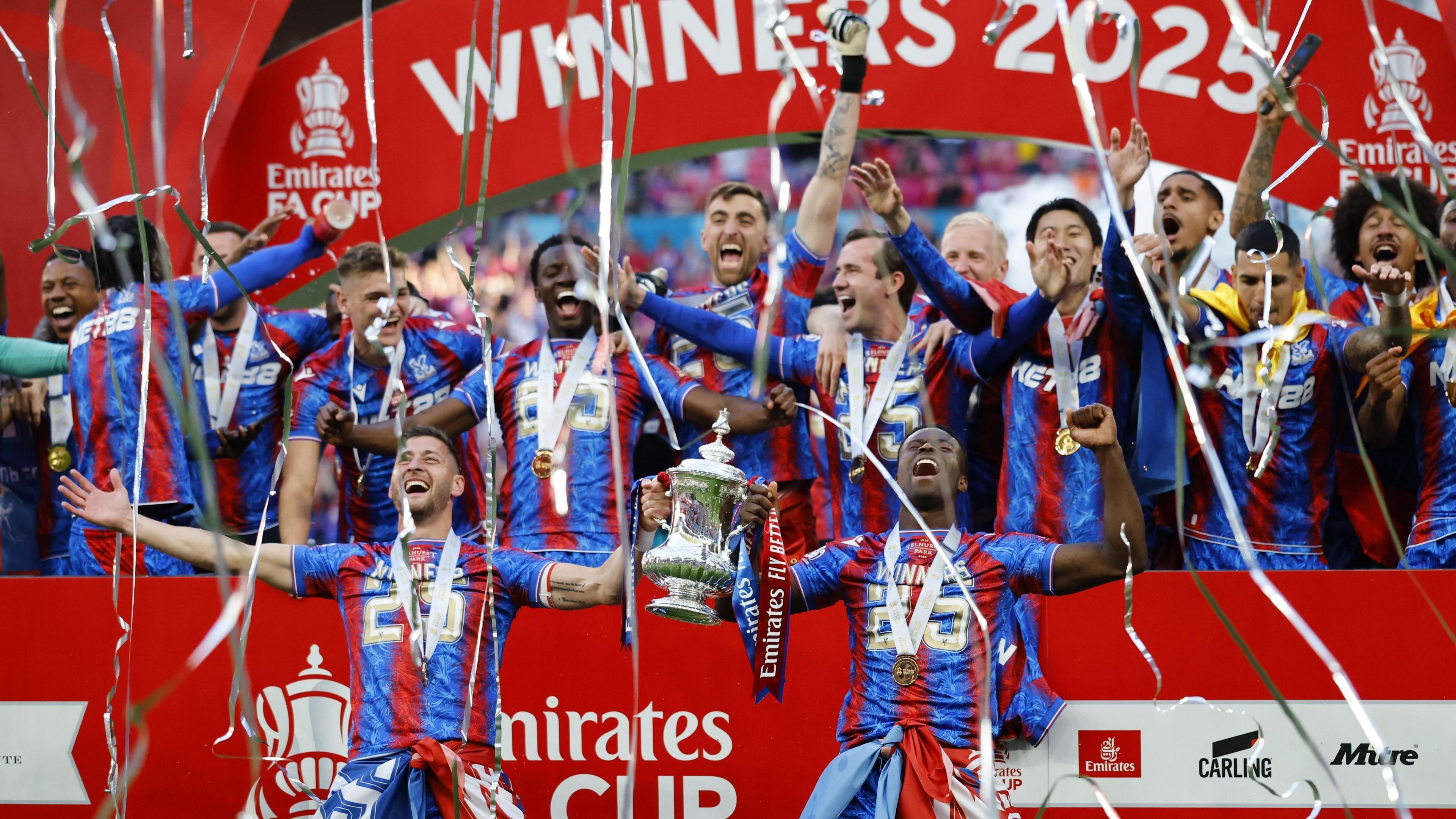 Players of Crystal Palace celebrate with the trophy after winning the FA Cup Final.
