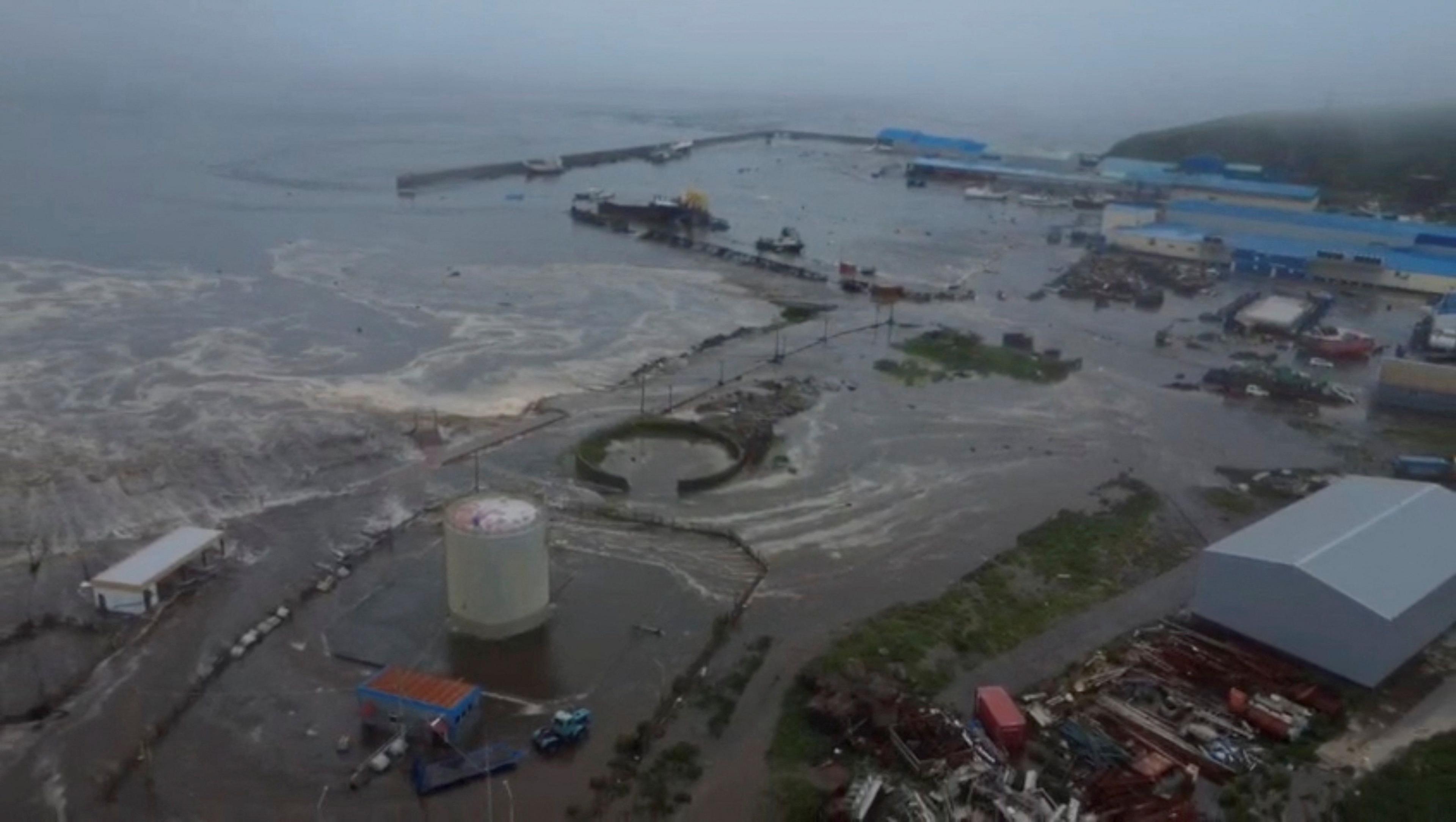 An aerial view of tsunami waves flooding the Severo-Kurilsk, Sakhalin region of Russia
