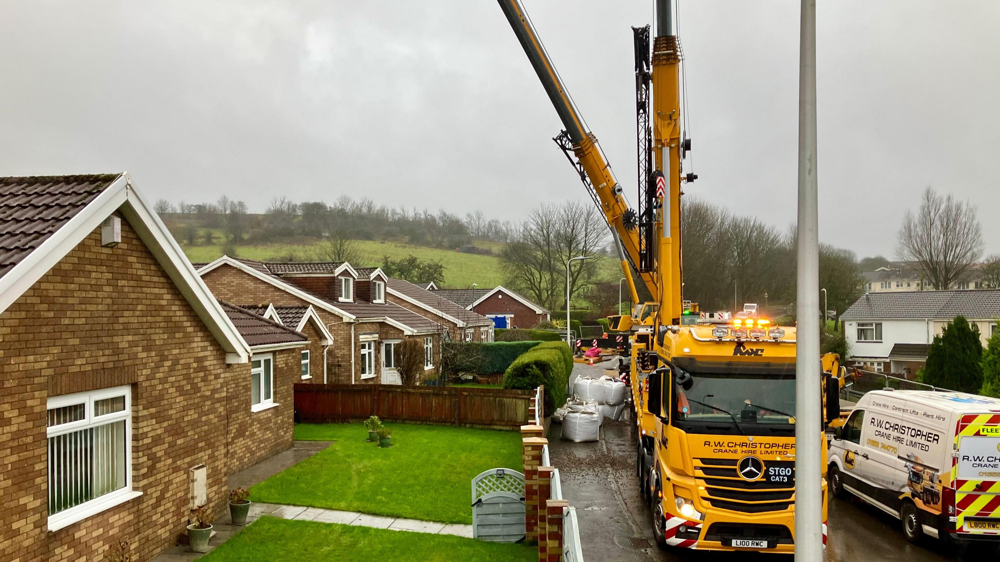 Tall pieces of equipment on vehicles in Nant Morlais